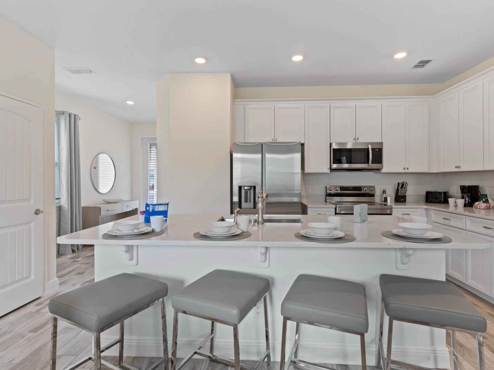 Polished kitchen of the cottage in Kissimmee Florida - Revel in the delight of fully equipped kitchen - Every corner is crafted for a seamless culinary experience - Stainless steel appliances