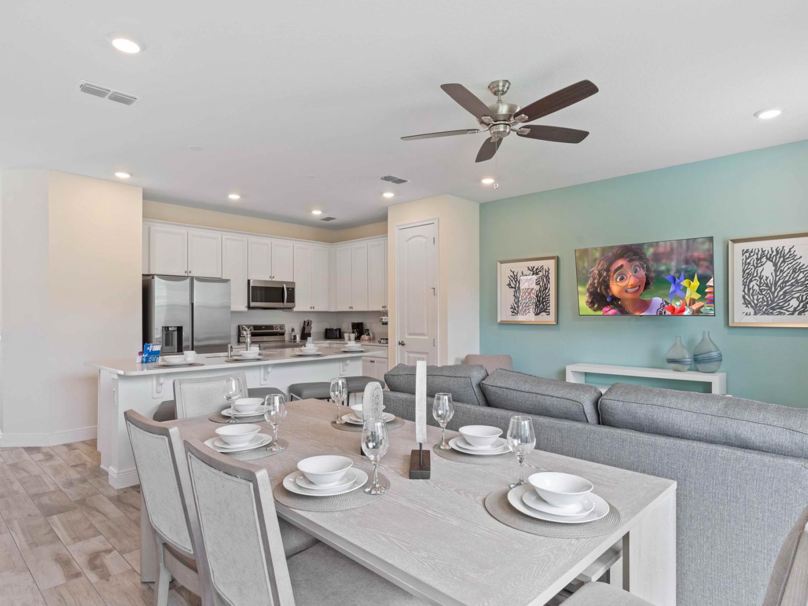 Beautiful cottage in Kissimmee Florida - Open concept connecting the kitchen to the dining and living area - Plush and comfortable seating arrangements - Stylish, contemporary furnishings enhancing the aesthetic