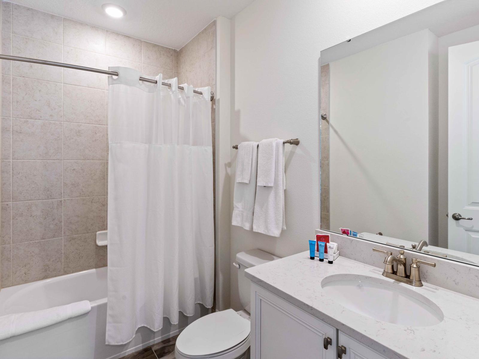 Bathing Bliss: Immerse yourself in bathing bliss in our bathroom with a shower/tub combo, providing the perfect spot for relaxation and rejuvenation.