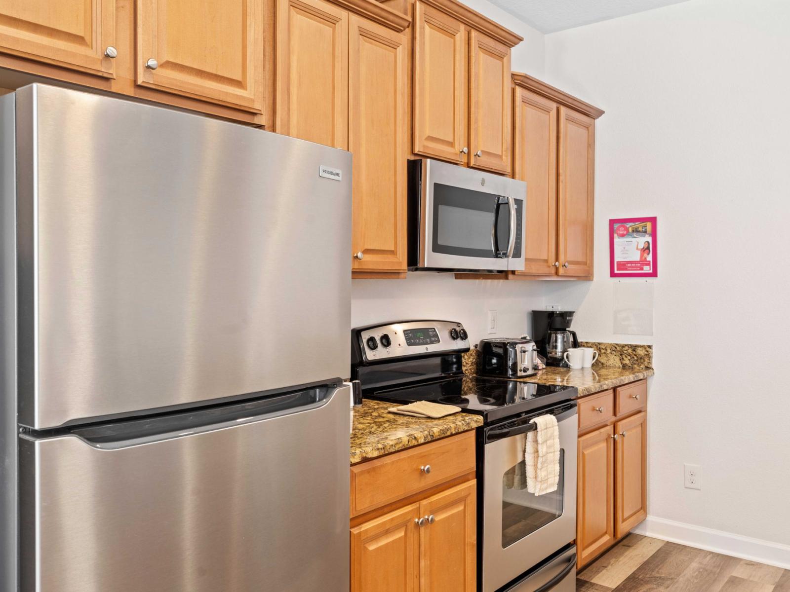 Charming kitchen of the townhouse in Kissimmee Florida - Modern kitchen with sleek, stainless-steel appliances - Smart use of space with versatile storage solutions - Fully Equipped