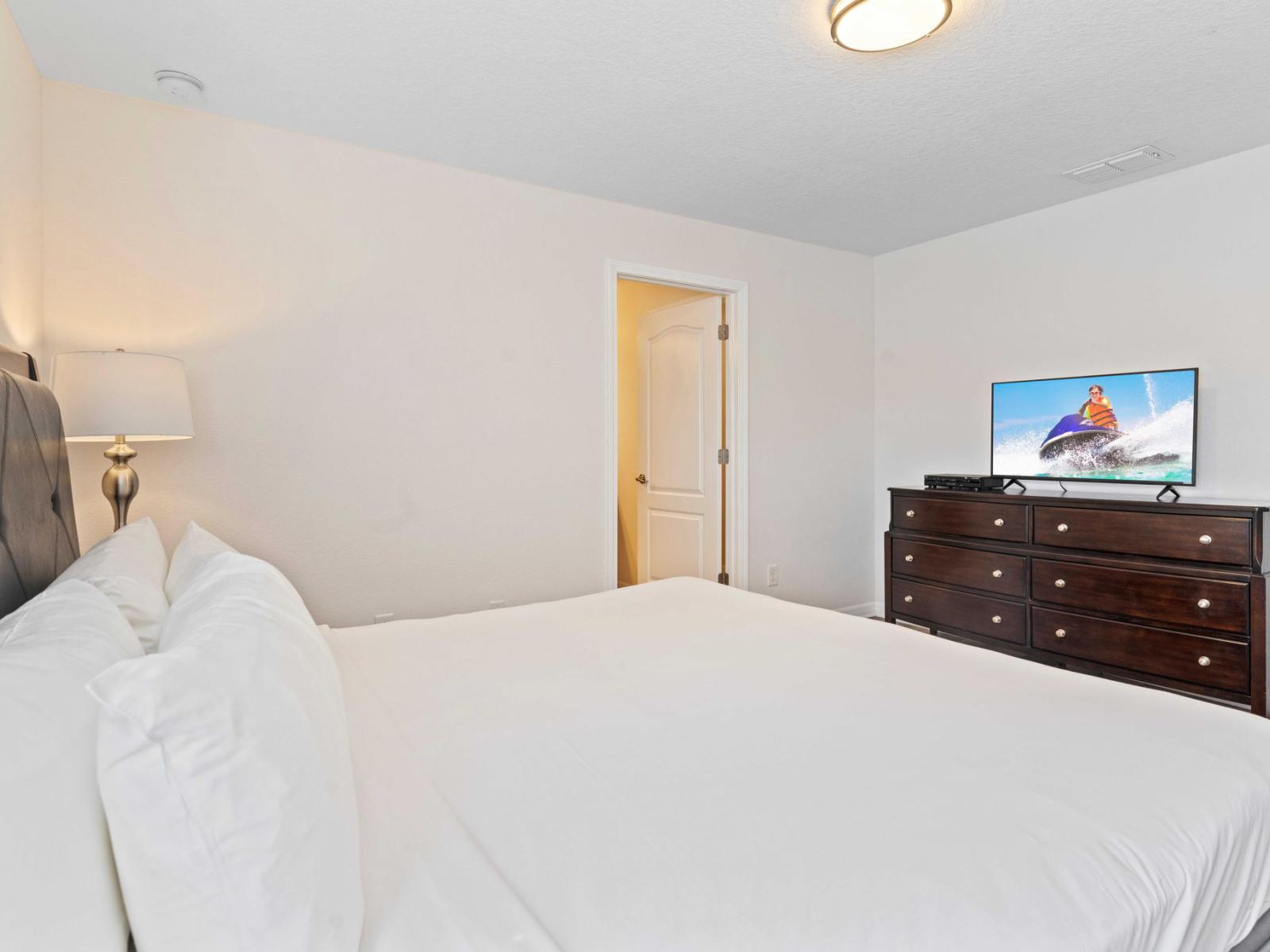 Indulge in Luxury: Unwind in Bedroom 2's Spacious Retreat, Featuring a King Size Bed and Private En-suite Bathroom.