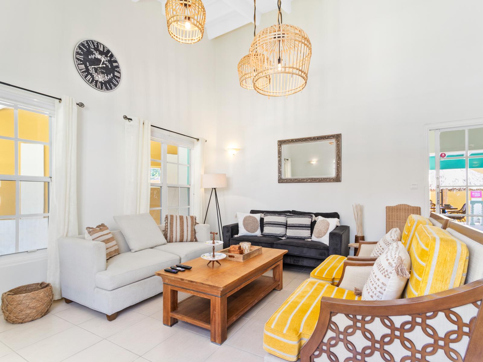 Pleasant Living Area of the 3BR House in Noord Aruba - Spacious living room with high ceilings - Cozy seating Arrangements - Majestic chandelier and lighting