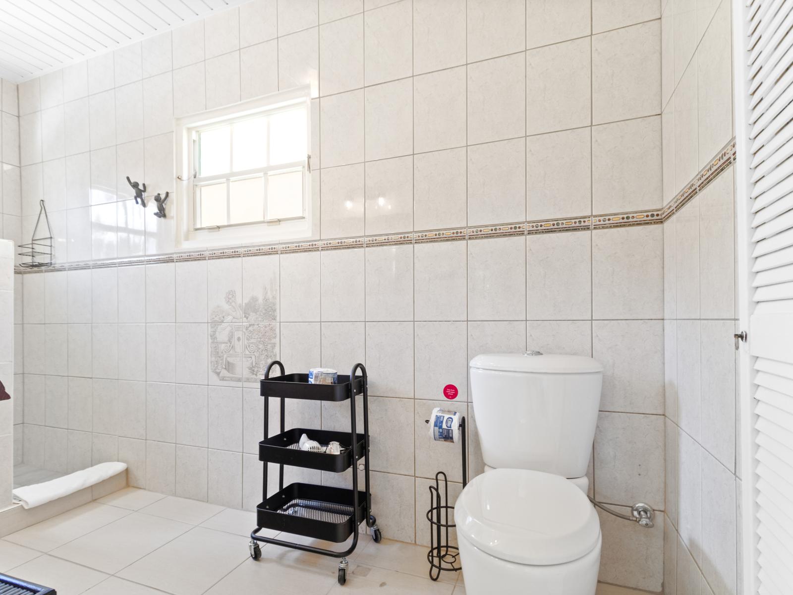 Lavish Tiled Bathroom of 3BR House Noord Aruba - Walk-in Shower Area - Neat and Clean Bathroom  - Elegant lighting - Light highlighting the elegant tile work