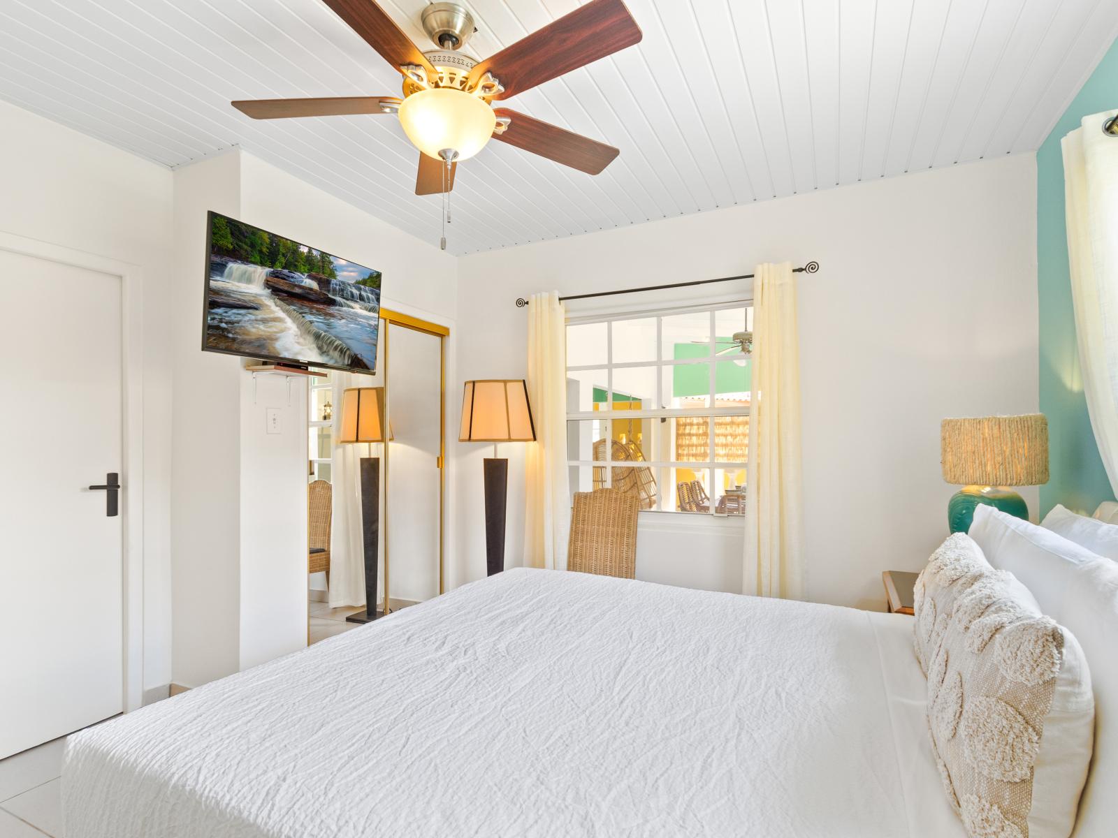 Picturesque Bedroom of the 3BR House in Noord Aruba - Bright and airy bedroom with large windows for natural illumination - Smart TV and Netflix - Thoughtfully designed bedroom featuring functional and stylish furniture - Comfy Bed