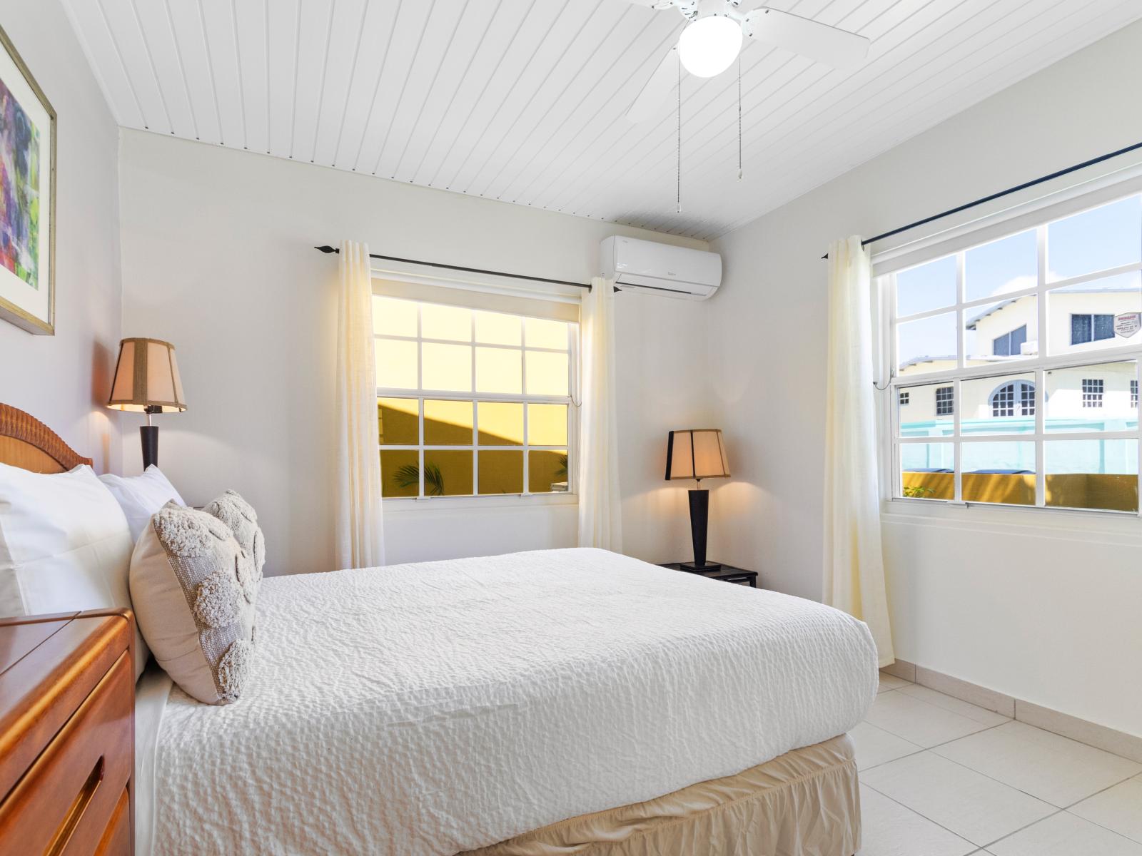 Deluxe Bedroom of the 3BR House in Noord Aruba - Comfy size Bed - Cozy retreat with a plush bed, perfect for relaxation - Stunning outside views - Full length mirror