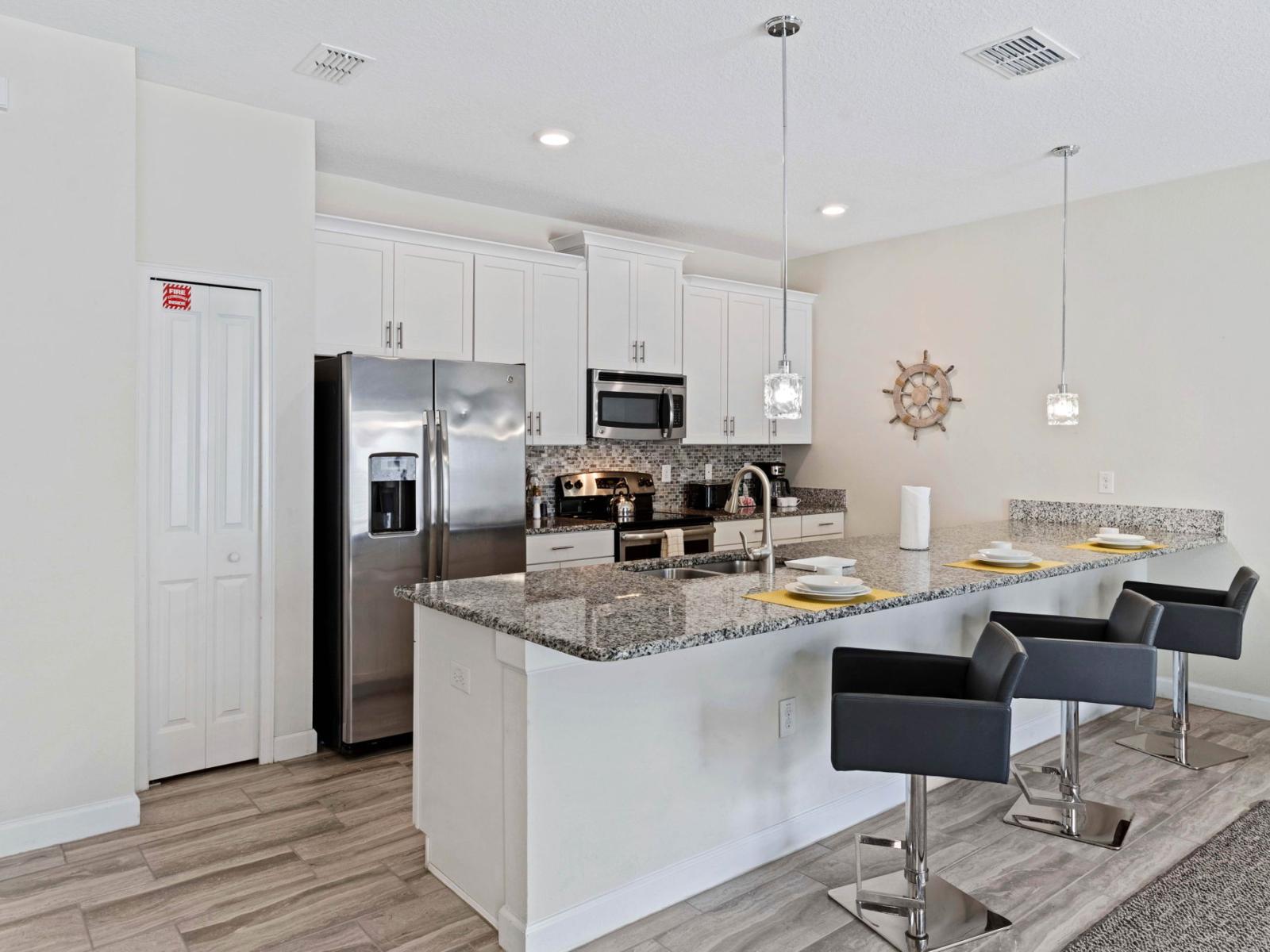 This modern kitchen comes with beautiful granite counter tops and stainless steel appliances, along with everything you need to cook up your family's favorite home-cooked meals.