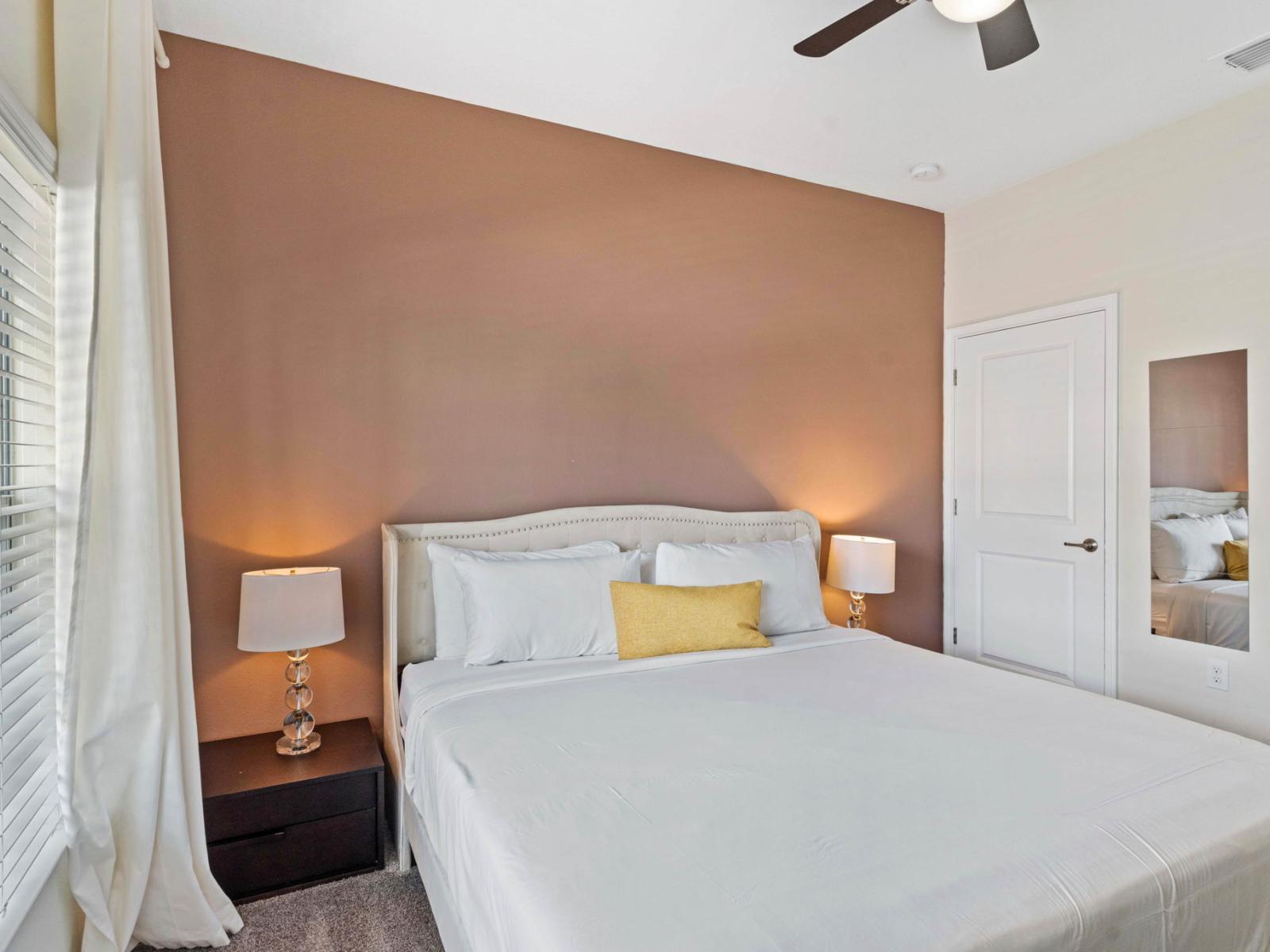 Regal Retreat: Unwind in the opulence of Bedroom 1, featuring a spacious king-size bed for the epitome of comfort.