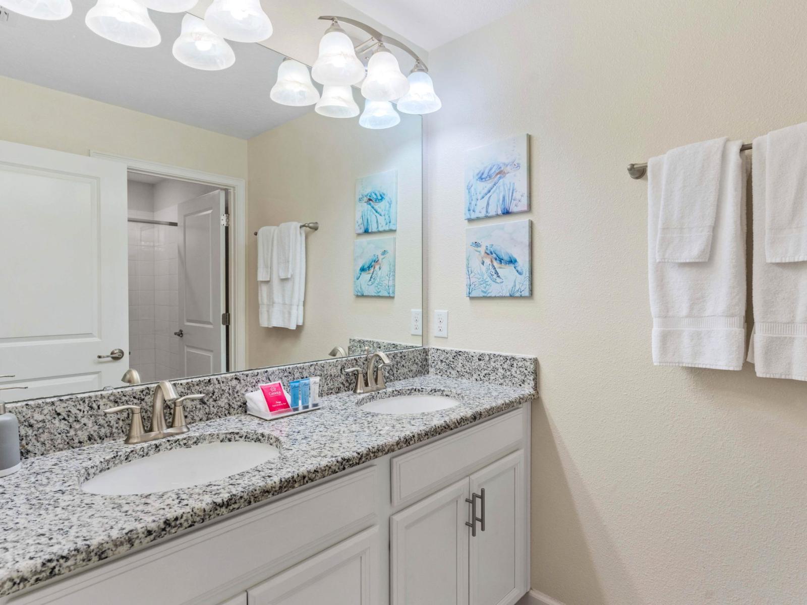 The bathroom 3 features a stylish walk-in shower designed for convenience and comfort. Walk-in showers are known for their accessibility and modern aesthetic.