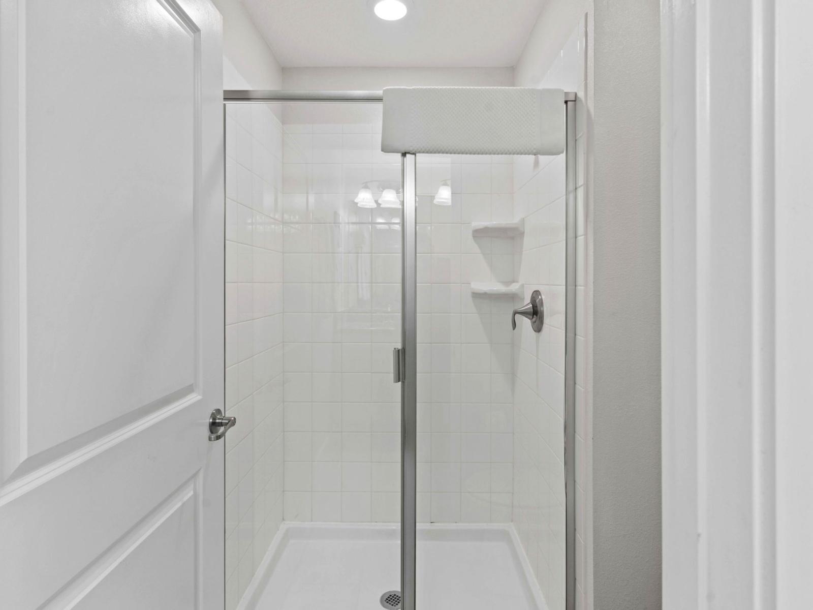 Sleek Shower Sanctuary: Step into sleek sophistication in our bathroom, featuring a stylish walk-in shower for a refreshing and rejuvenating experience.