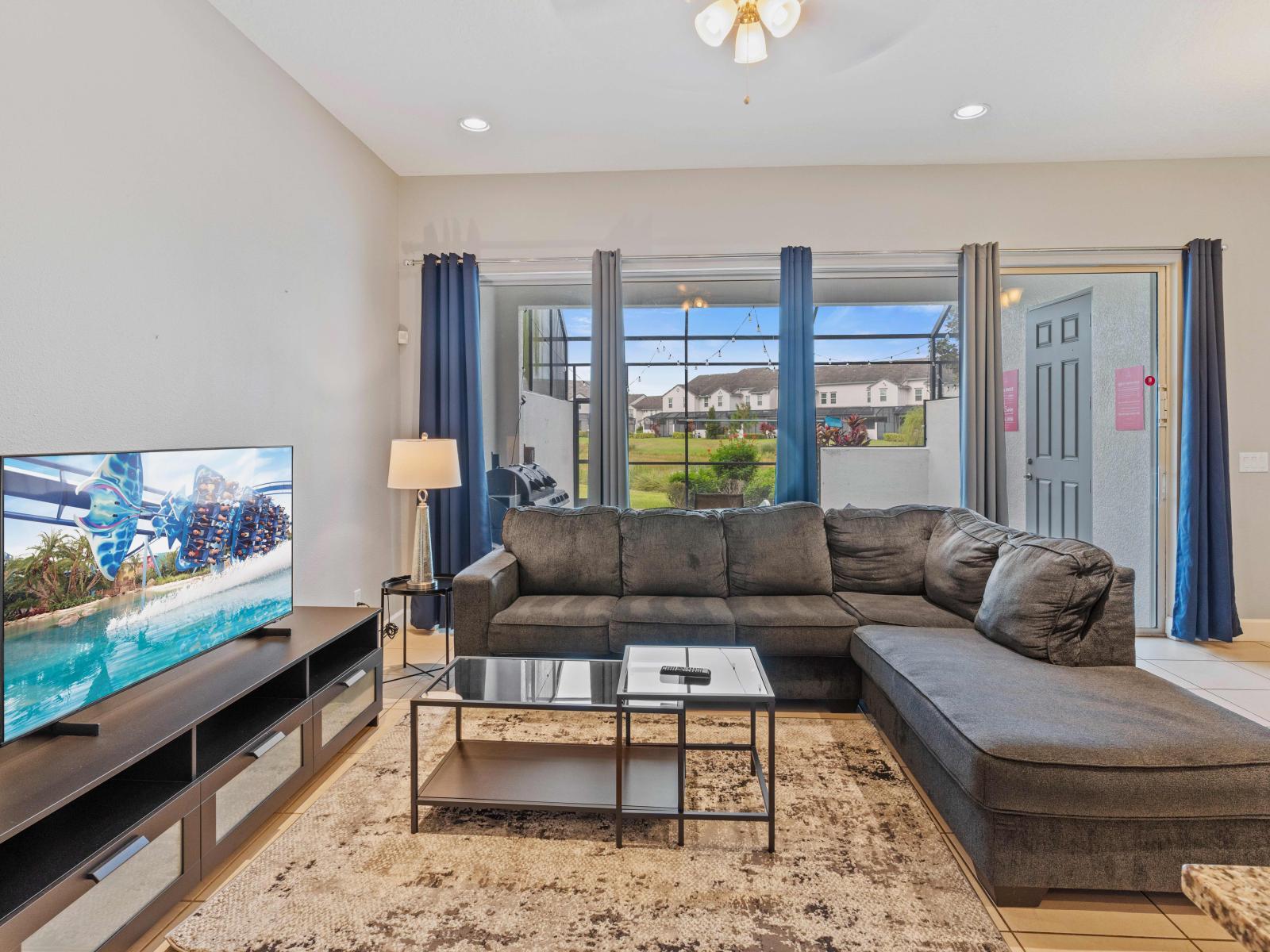 Bright Living Area of the Townhouse in Davenport Florida - Indulge in elegant entertainment in living area - Provides endless viewing options for your pleasure - Smart TV and Netflix