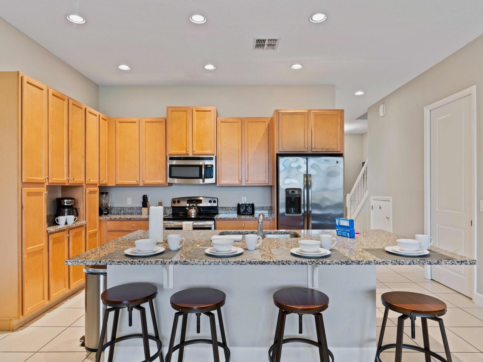 Lofty Kitchen of the Townhouse in Davenport Florida - Open concept kitchen, with direct access to the dining area for effortless connectivity - Breakfast bar and high chairs - Fully equipped