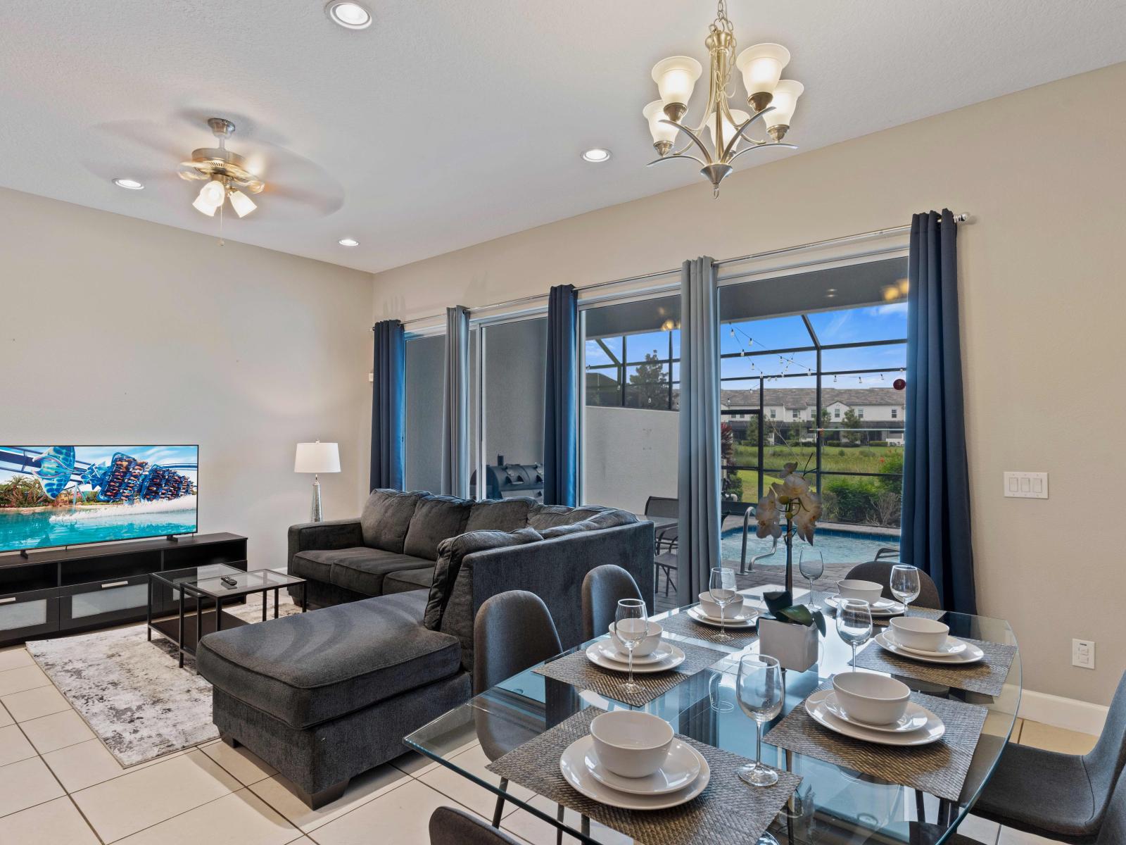 Elegant Dining and Living Area of the Townhouse in Davenport Florida - Experience the convenience of a dining area next to the living space - Plush and comfortable seating arrangements - Easy access to outdoors