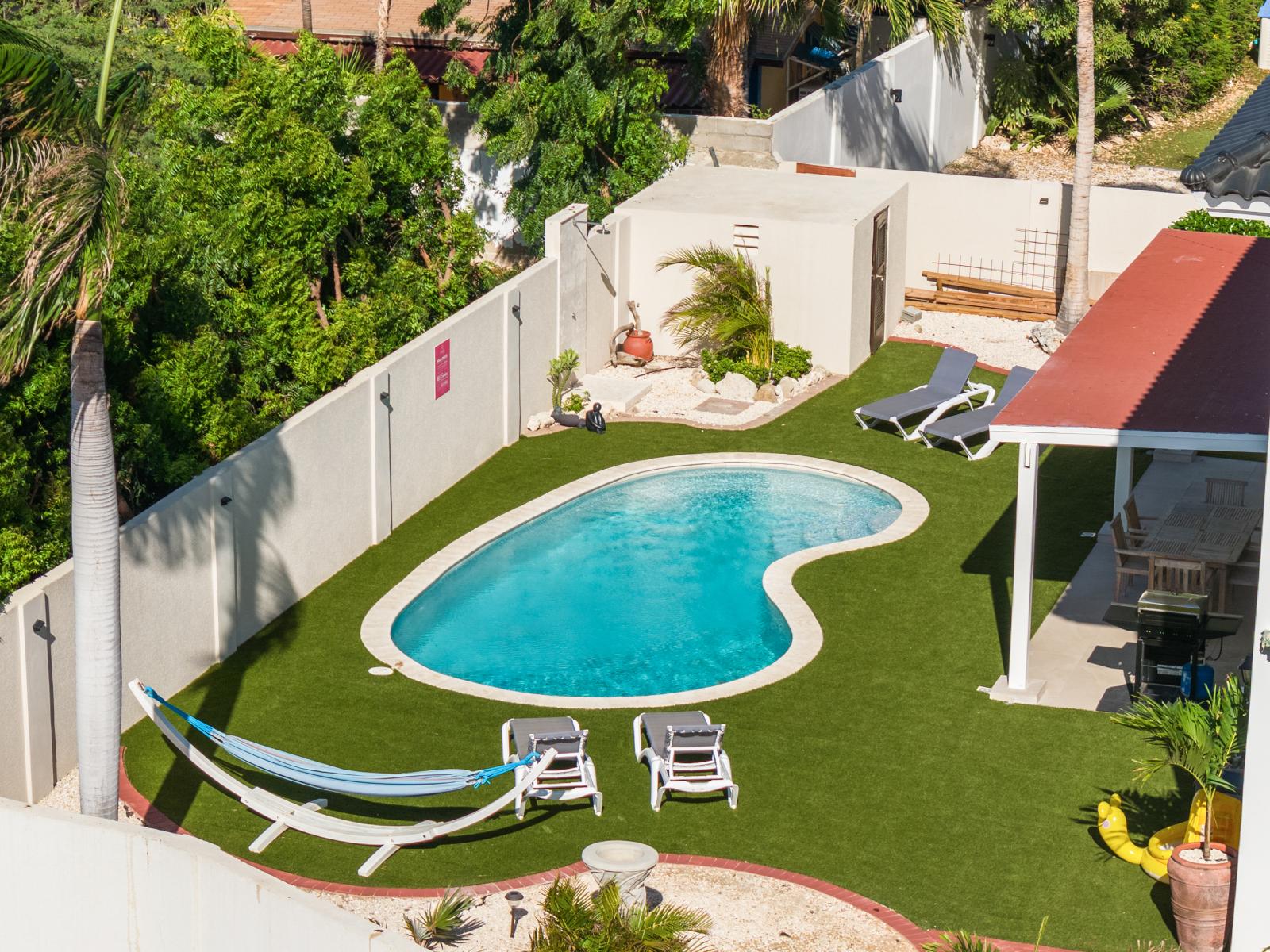 Take flight into tranquility with our aerial view of the backyard, a picturesque retreat blending natural beauty with modern comforts. Whether lounging by the pool or dining al fresco, our outdoor haven sets the perfect scene for unforgettable moments.