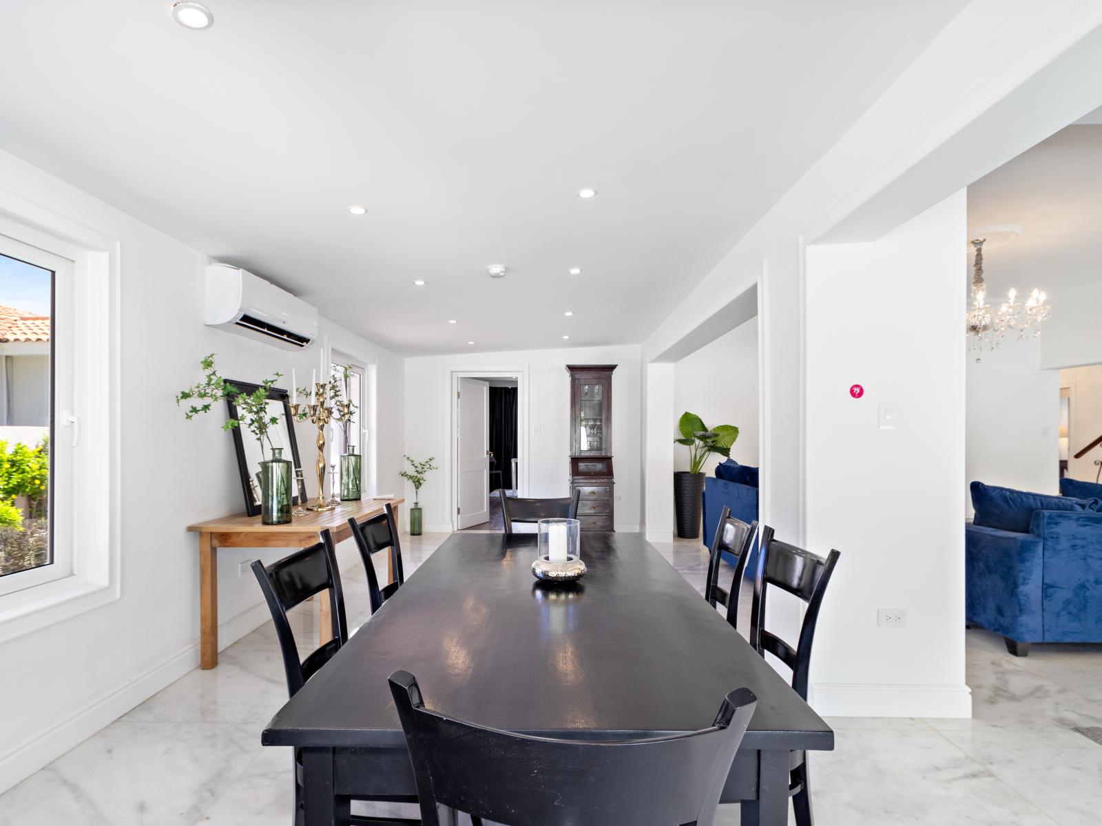 Dining table number two, offering a distinct style and seating arrangement, adds versatility to the dining area, allowing for different settings.