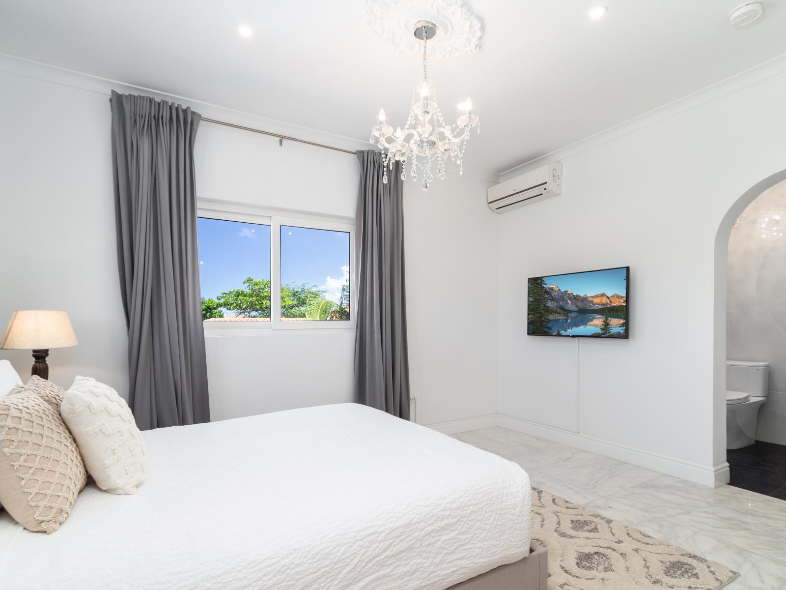 Experience comfort and entertainment in Bedroom 3, complete with a Smart TV for your viewing pleasure. Whether winding down with a favorite show or catching up on the latest movies, this cozy retreat offers the perfect blend of relaxation and entertainment