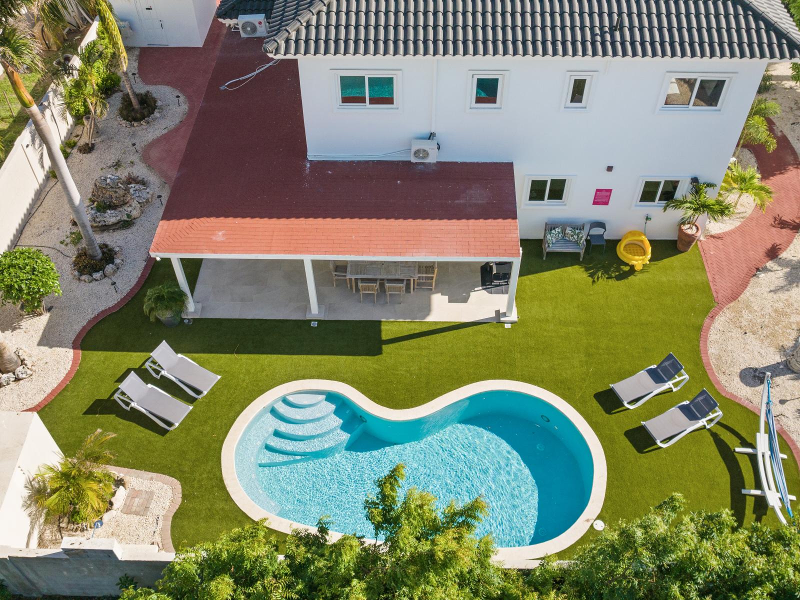 An aerial view of the backyard of the home, offering a bird's-eye perspective of the outdoor space.