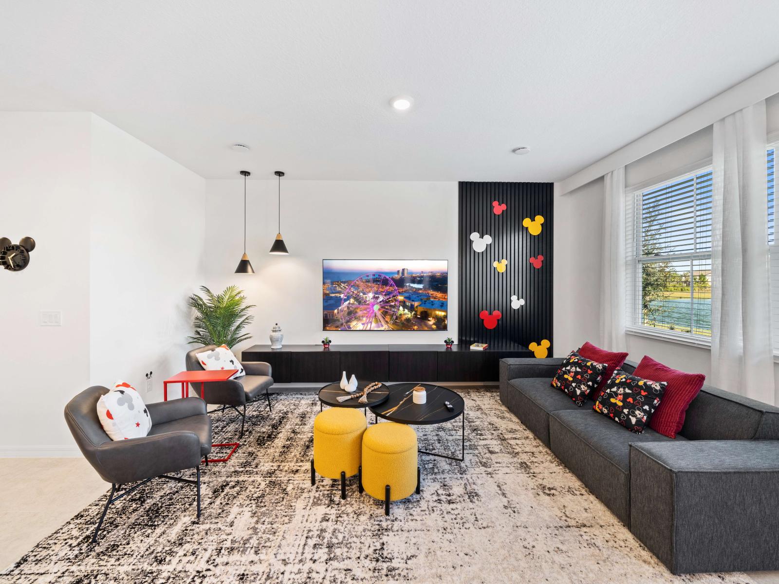 Enchanting Living Area of the Townhouse in Davenport Florida - Smart TV and Netflix - Elegant Micky Themed decor - Stylish furniture arrangement providing comfort and a cohesive look