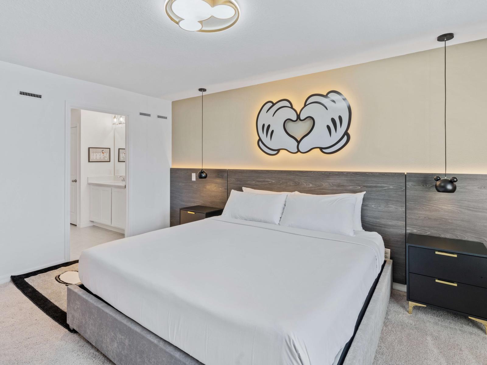 Stunning Bedroom of the Townhouse in Davenport Florida - Attached bathroom for privacy and convenience - Cozy double bed - Well-chosen lighting fixtures adding both functionality and charm