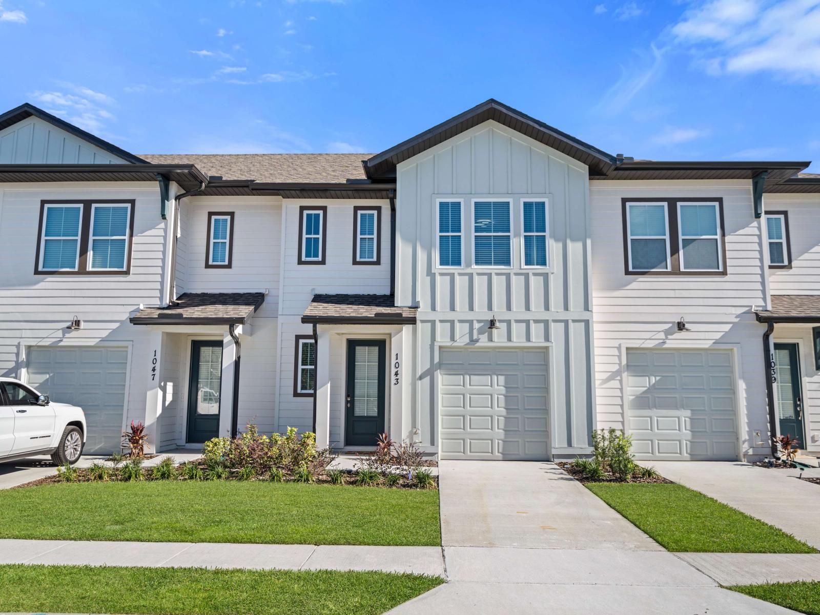 Delightful Entrance and garage of the Townhouse in Davenport Florida - Discover the seamless blend of luxury and convenience - Your exclusive passage to a delightful stay