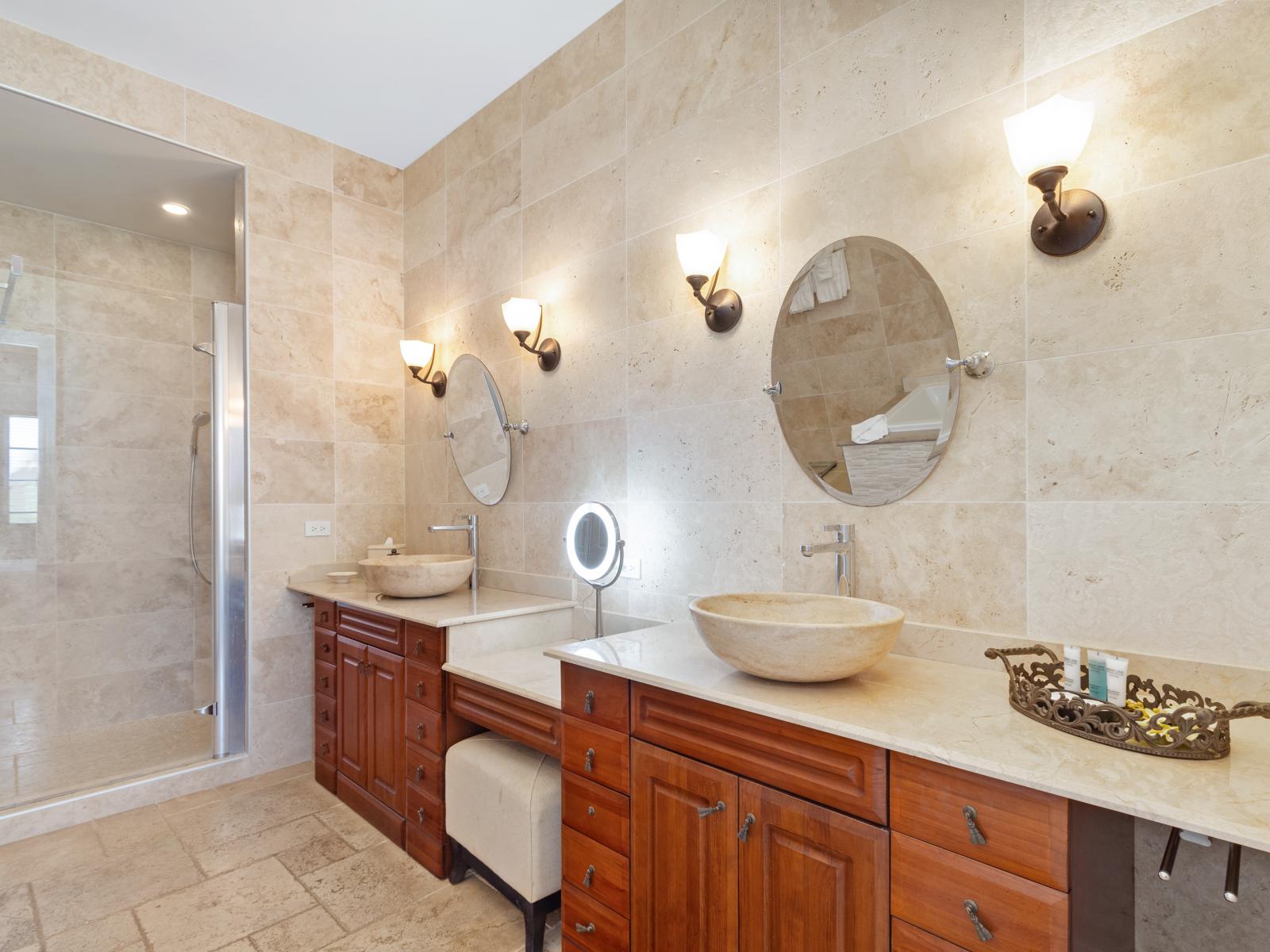 Elevate your morning routine in our main bathroom, featuring double sinks for added convenience. Start your day refreshed and revitalized, with ample space for you and your fellow guests to prepare for your adventures ahead.