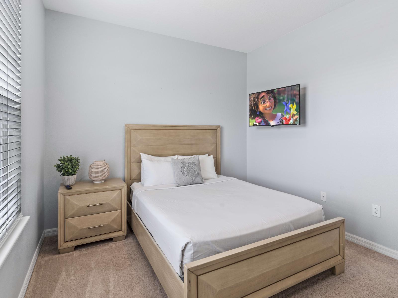 Unwind in comfort in our stylish first bedroom featuring a spacious queen bed