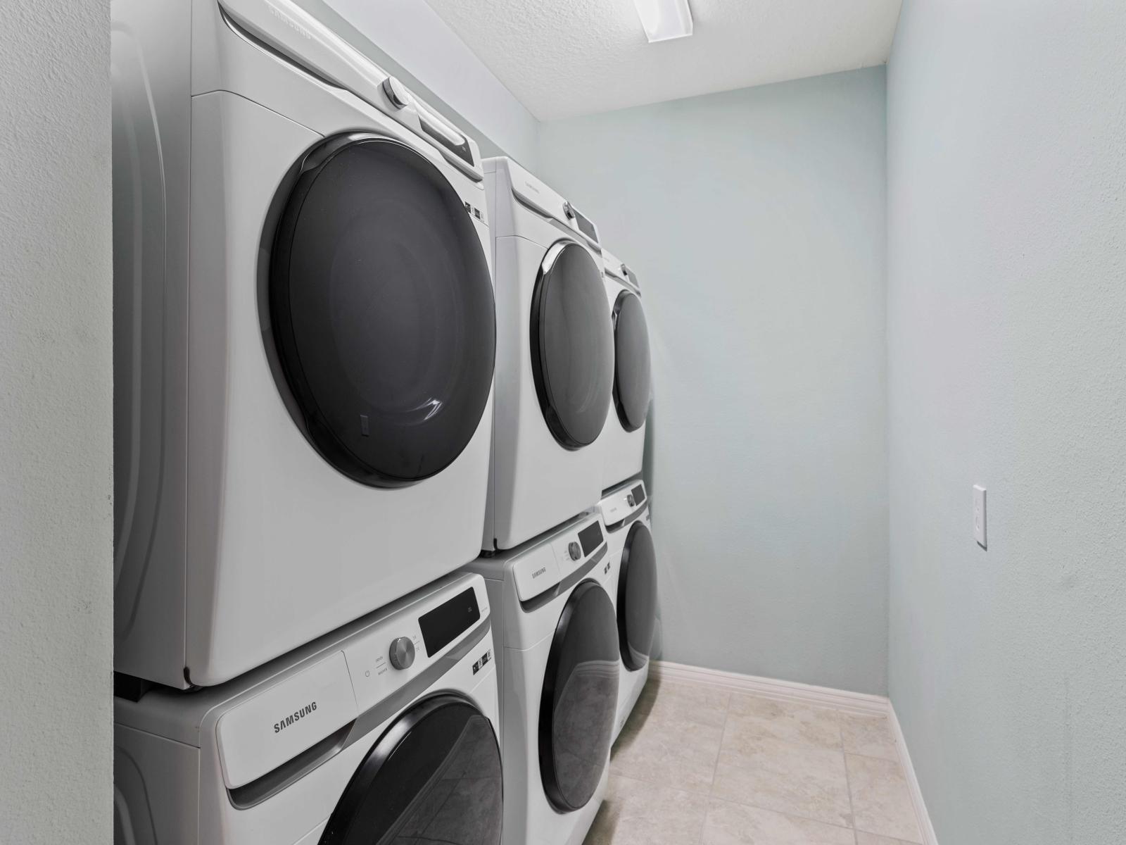 Laundry room with 3 full washers and dryers