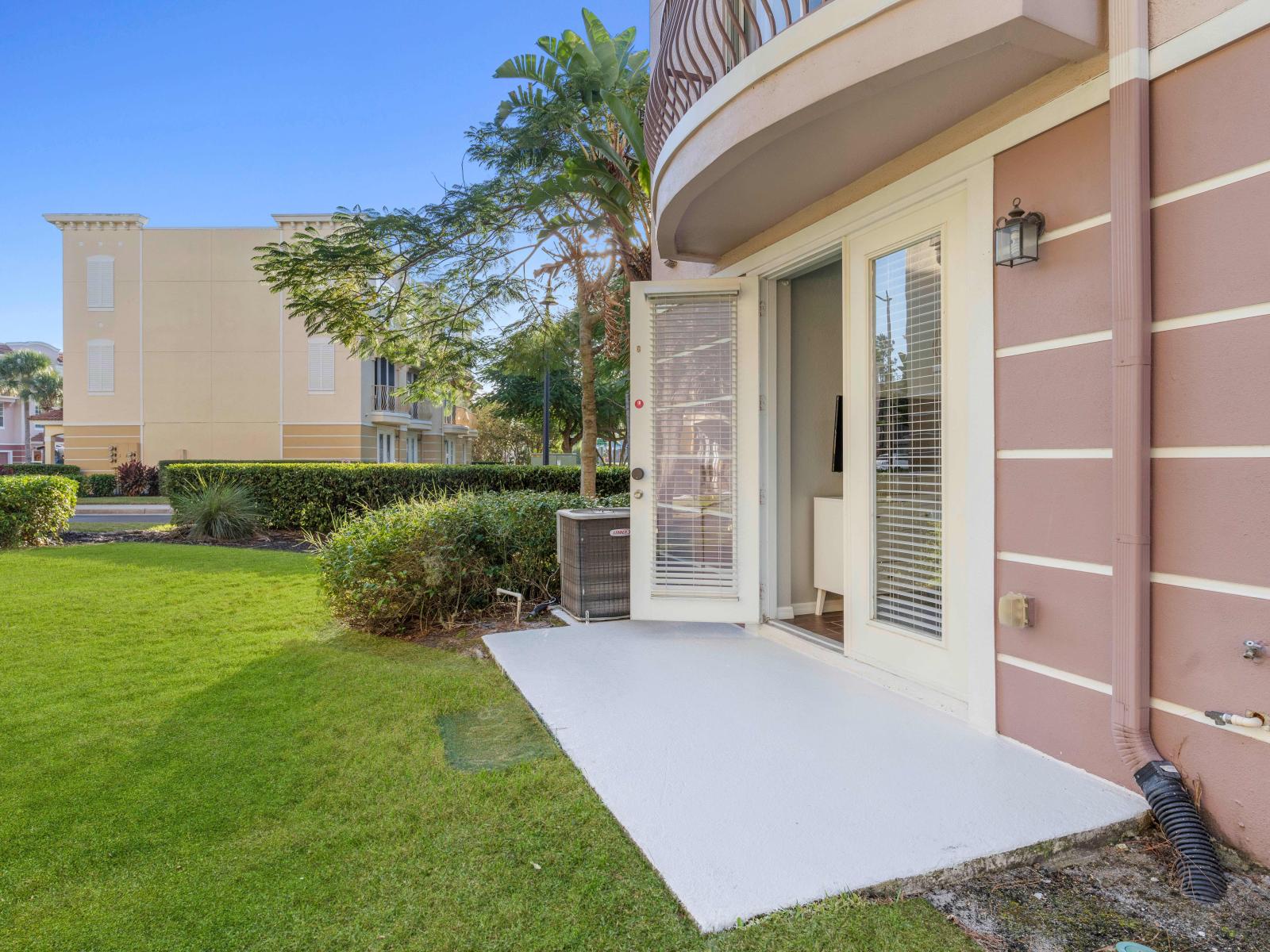 Step into your own outdoor patio connected with the bedroom of this charming townhouse in Orlando - A perfect spot for enjoying meals, drinks, and laughter under the open sky - Enjoy scenic views of the surrounding landscape from the private patio