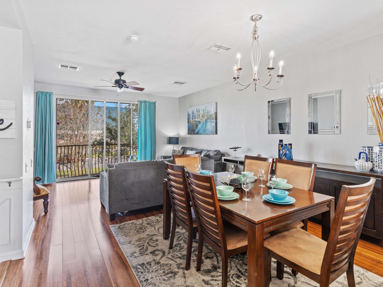 Modern living room equipped with a smart TV and a charming dining space.