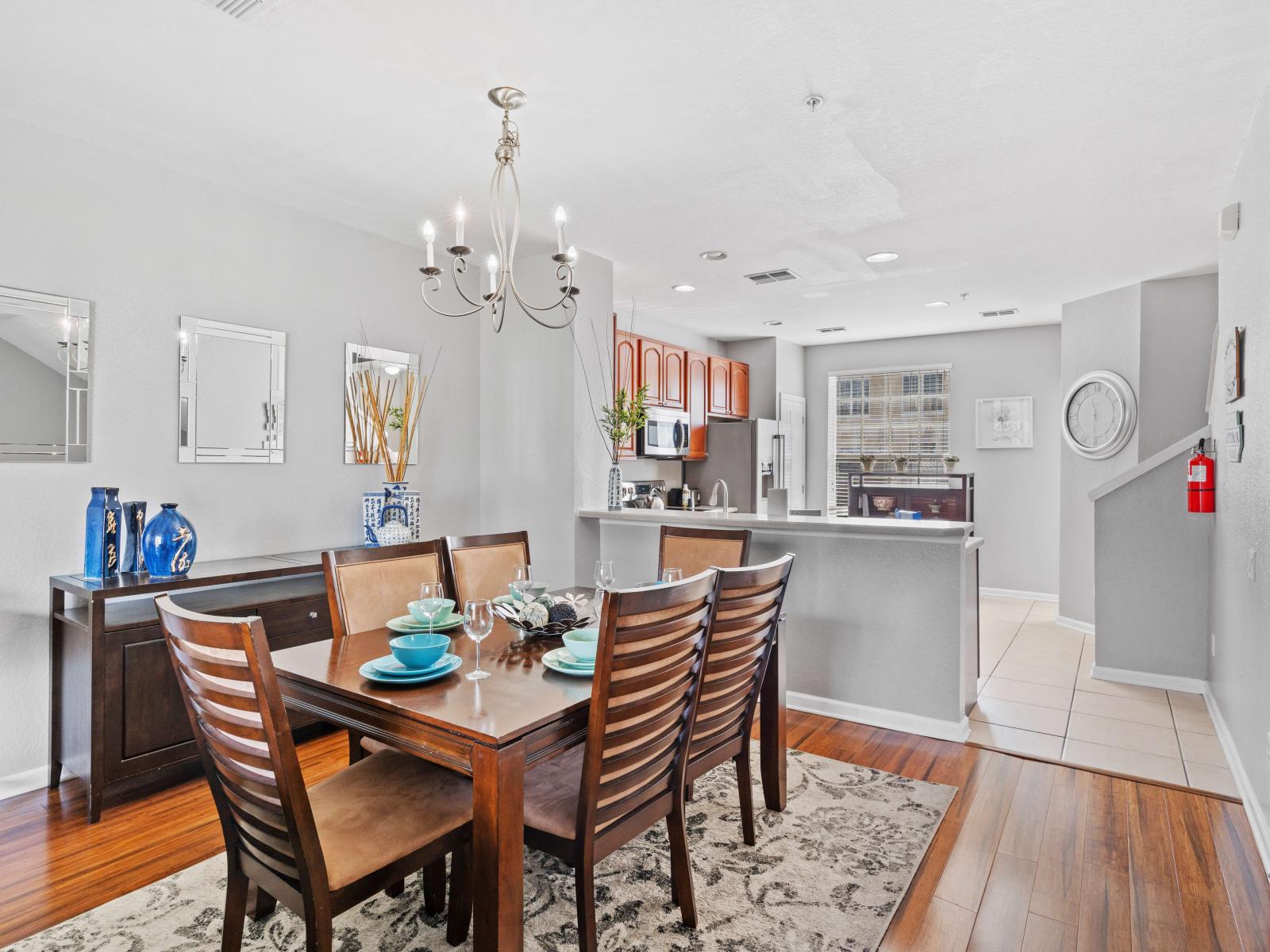 Step into the dining area seamlessly connected to a fully equipped kitchen, where every meal becomes a culinary adventure. A space designed for gathering and indulgence, promising delightful flavors and shared moments in the heart of the home.