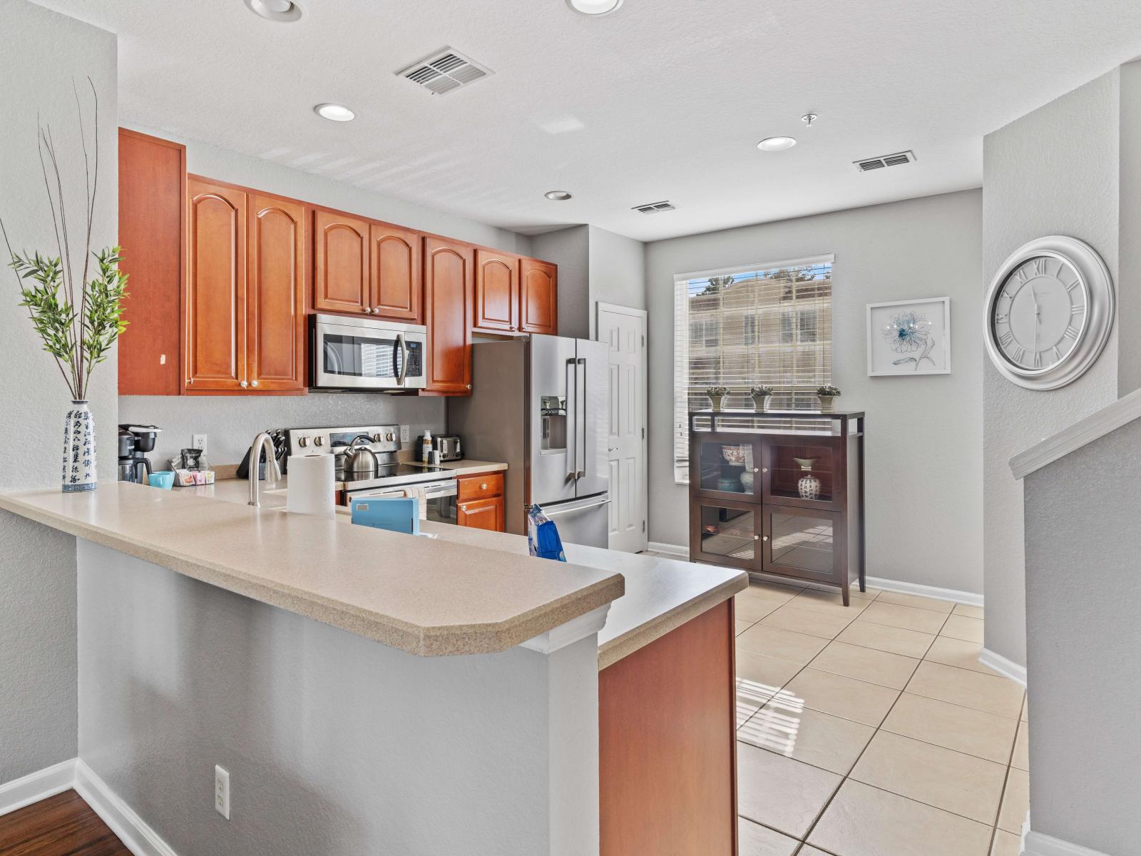 This fully equipped kitchen is a chef's dream, boasting modern appliances and ample space to unleash culinary creativity and prepare delicious meals with ease.