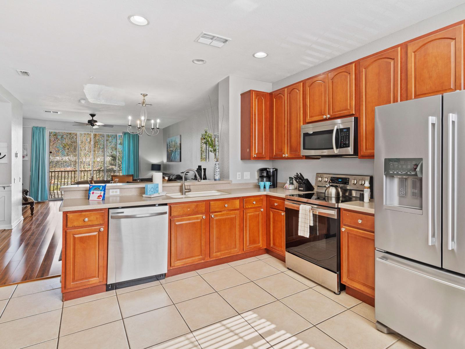 The Kitchen offers an engaging spot to gather for family dinners and includes updated appliances and granite counter tops.