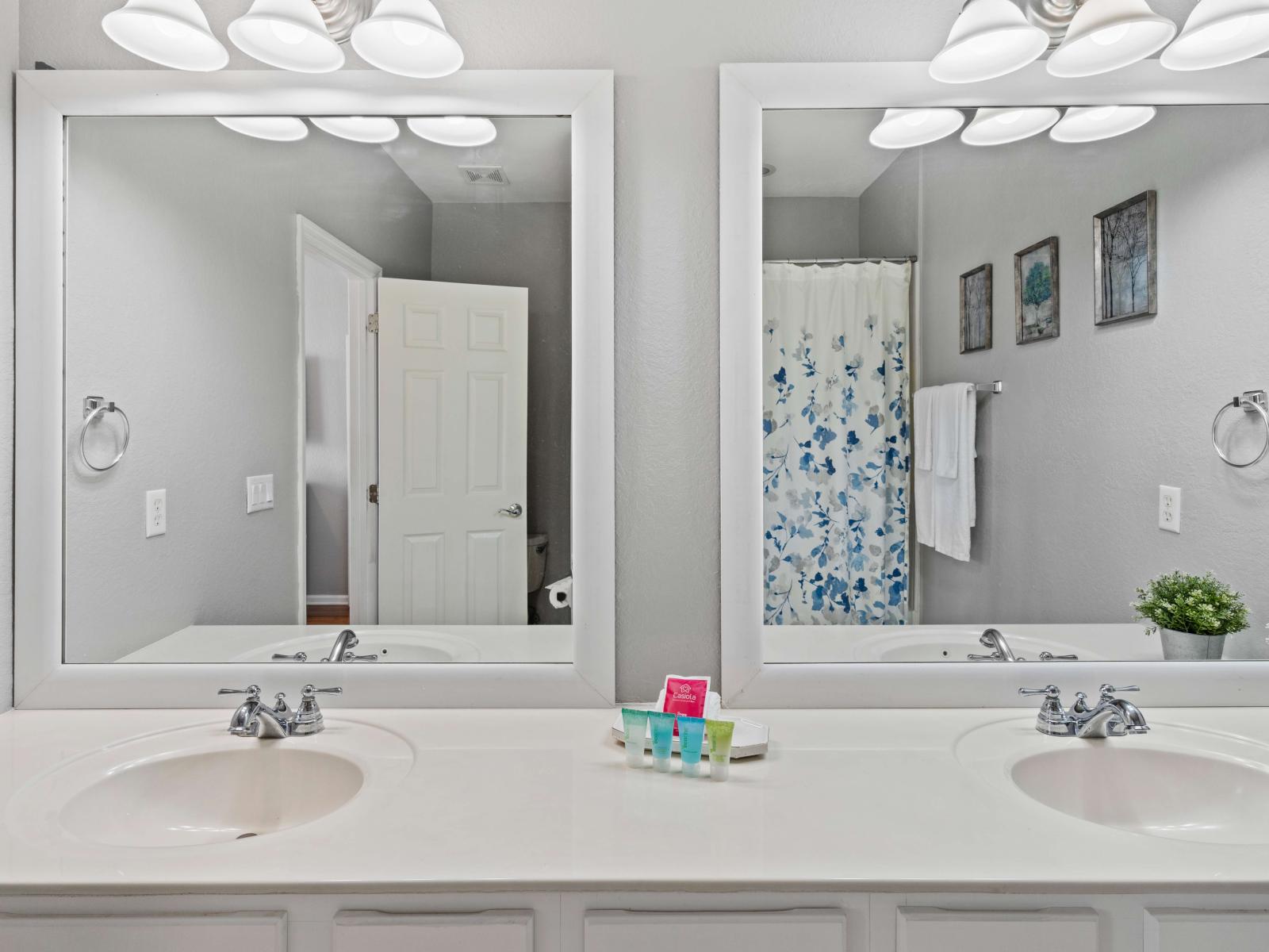 Bathroom 2 features a spacious double vanity and a luxurious tub/shower combination. A contemporary retreat offering convenience and relaxation in equal measure, promising rejuvenating baths and tranquil moments of self-care.