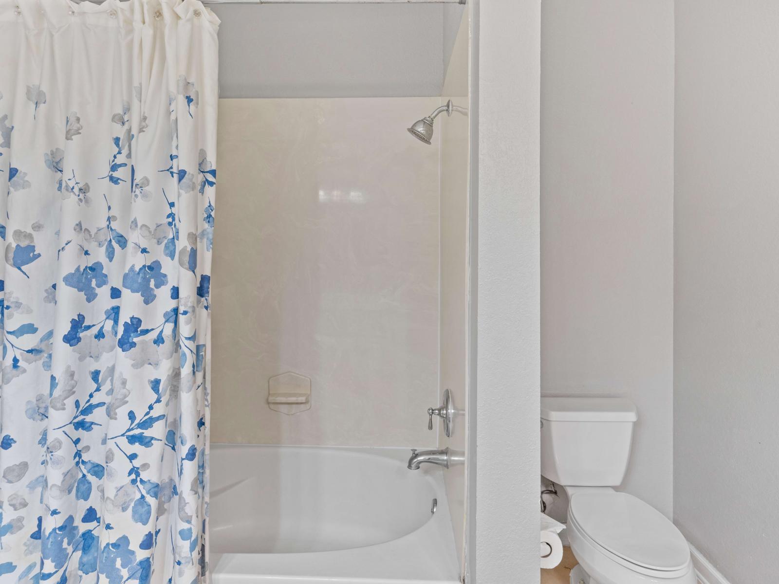 Bathroom 2 offers a sense of spaciousness with its double vanity and a convenient tub/shower combination.