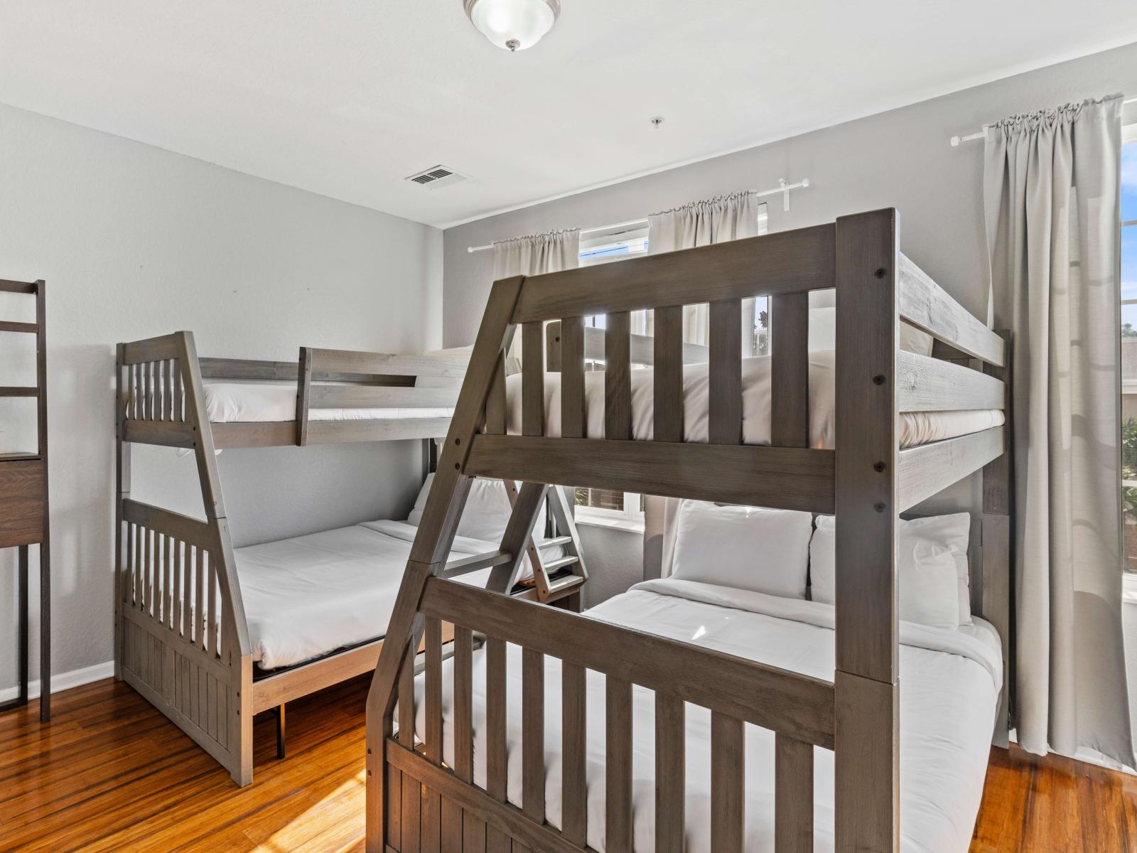 Bedroom 3 features two single over double size bunk beds, creating a cozy haven for a restful night's sleep.