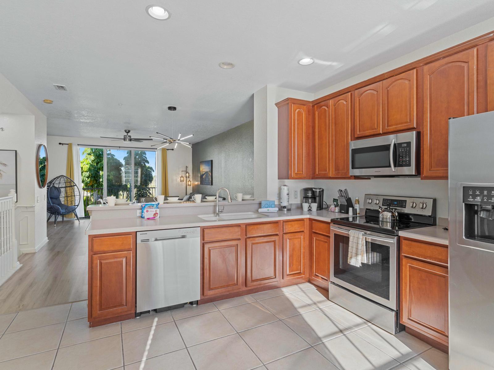 Culinary Haven of the Townhouse at Vista Cay Resort in Orlando. - Fully equipped with  all necessary kitchen amenities. - Glorious breakfast bar. - Offering plenty space to tore goods. - Create and enjoy delicious meals in the comfort of the home.