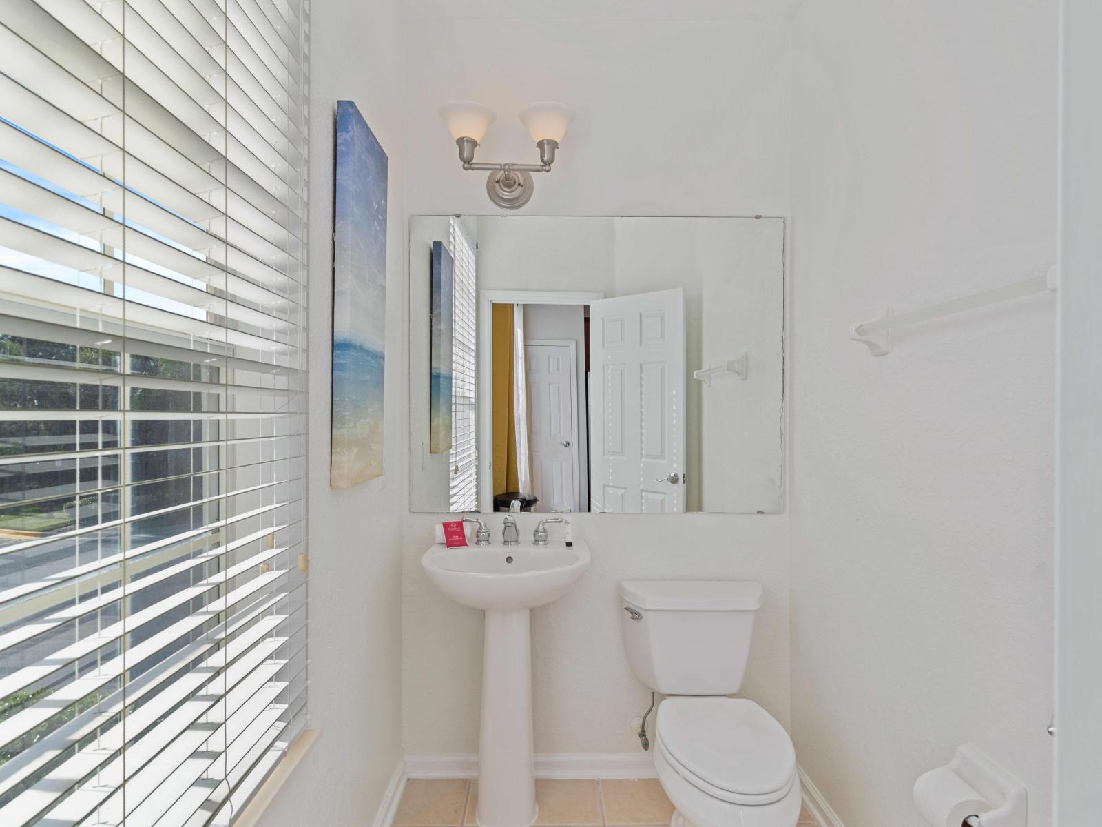 Ensure the comfort of your guests with the inclusion of a half bathroom in our townhouse at Vista Cay Resort - Step into our half bathroom and experience modern elegance - Neat and clean toilet seat - Elegant sink with large size wall mirror