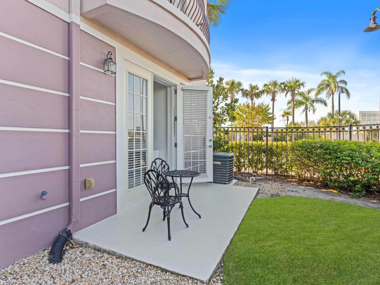 Bask in the warmth of the sun on our patio outside Bedroom of the townhouse at Vista Cay Resort - Featuring a cozy seating area and scenic views for enjoying the beauty of the outdoors - Dine under the stars on our outside patio