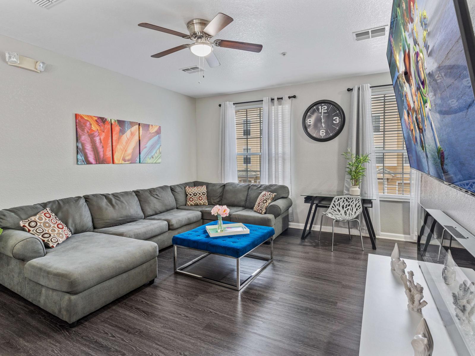 - Spacious living area of the townhouse in Orlando Florida - Watch your favorite shows on the smart TV - Stylish furniture arrangement providing comfort and a cohesive look - Cozy seating area conducive to relaxation and socializing