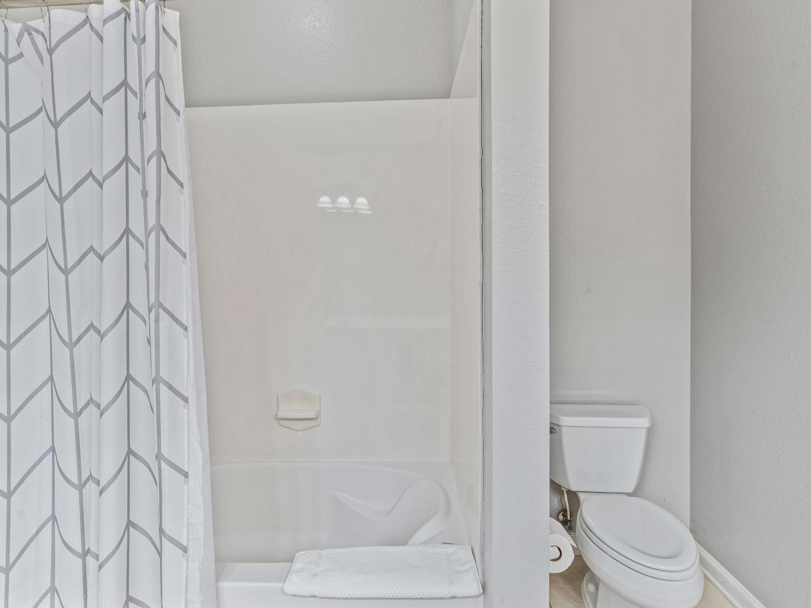 Bathroom 2 with double vanity and tub/shower combination