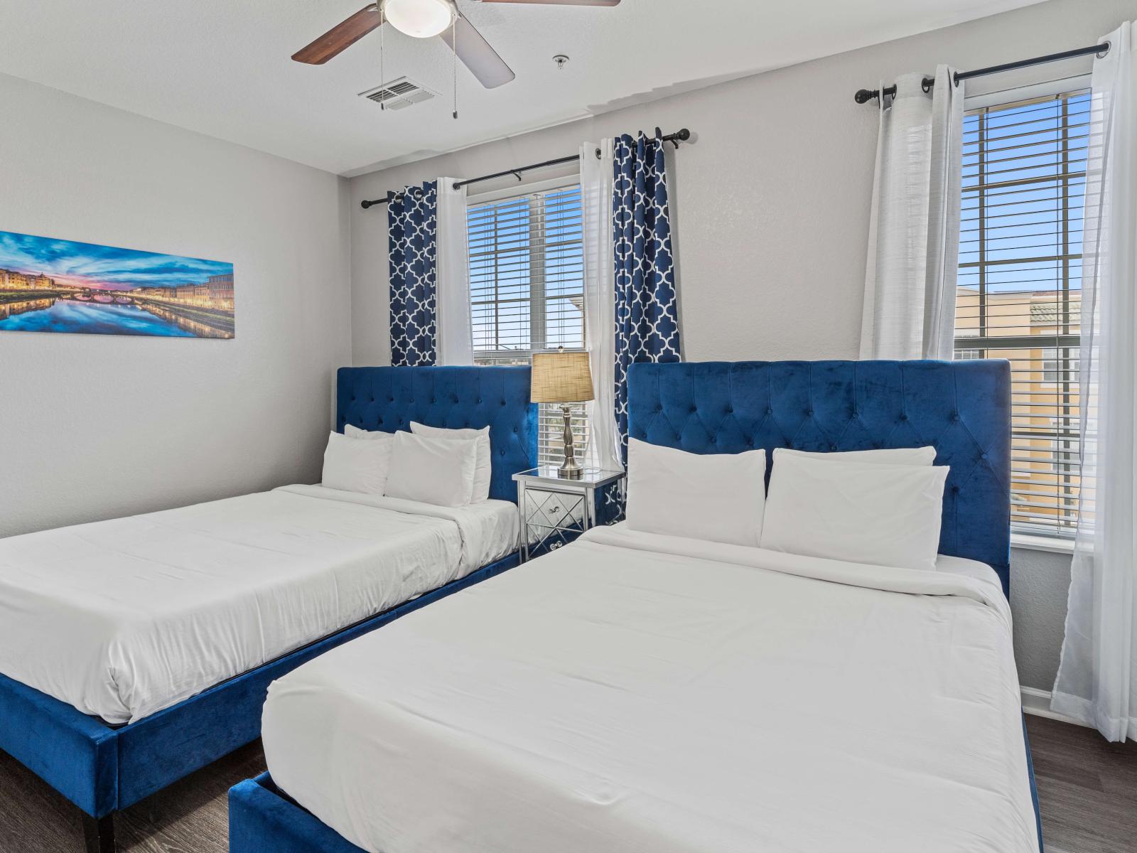 - Elegant bedroom  of the townhouse in Orlando Florida - Stunningly located big and bright bed back windows with lush views - Two cozy double bed - Elegant color scheme creating a soothing atmosphere - Aesthetic wall painting used for the decoration