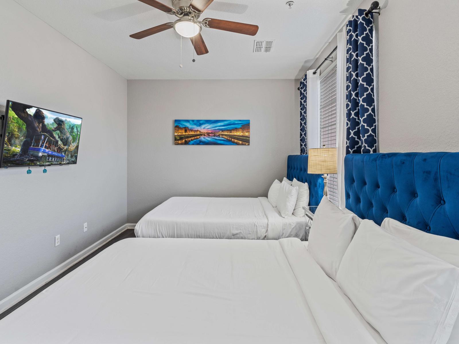 - Welcoming bedroom of the townhouse in Orlando Florida - Completed with 2 cozy beds - Elegant design and modern furnishing - Wooden furnished floor - Watch your favorite movies with a bliss of smart TV