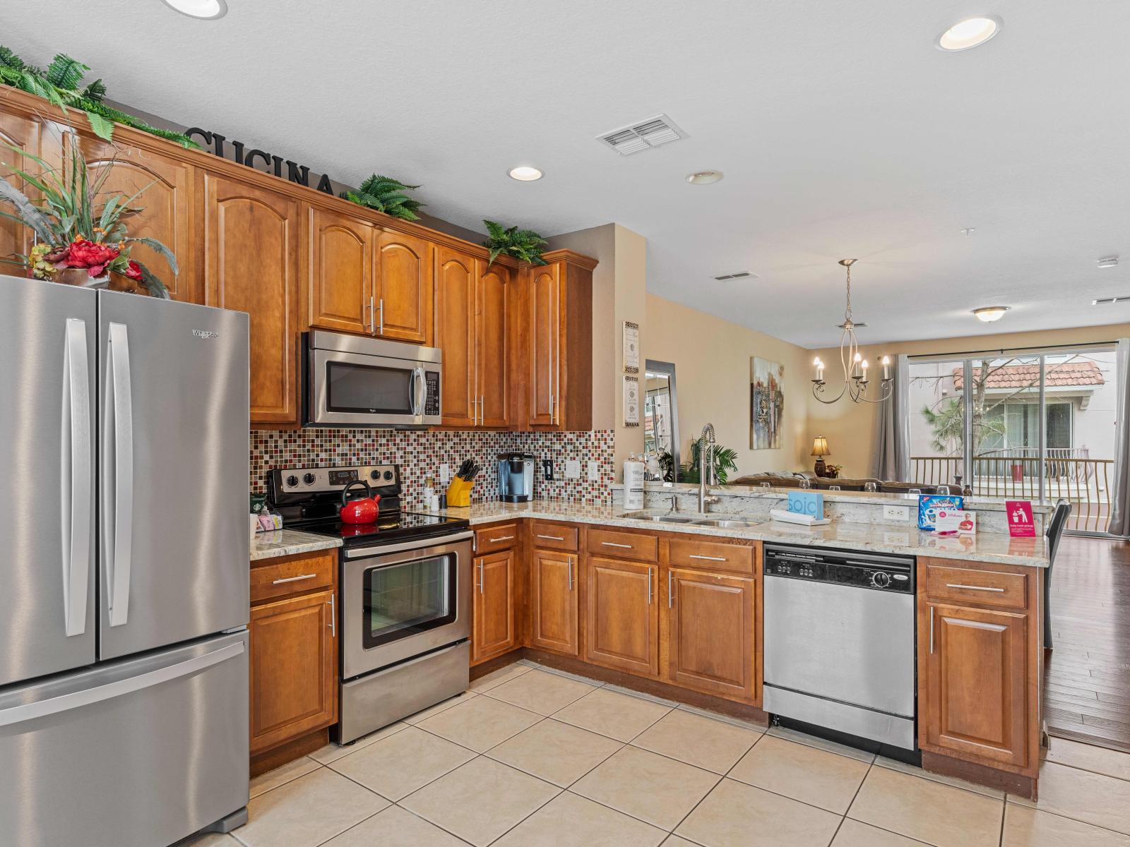 Gloriously designed kitchen of the townhouse in Orlando - Fully Equipped with all kitchen accessories - Sufficient storage space in the cupboards throughout the kitchen - Completely brightened space