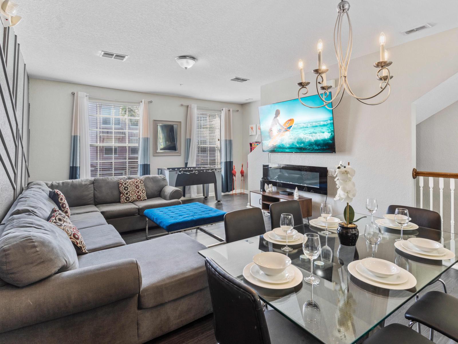 Living room with foosball table, electric fireplace and Smart TV