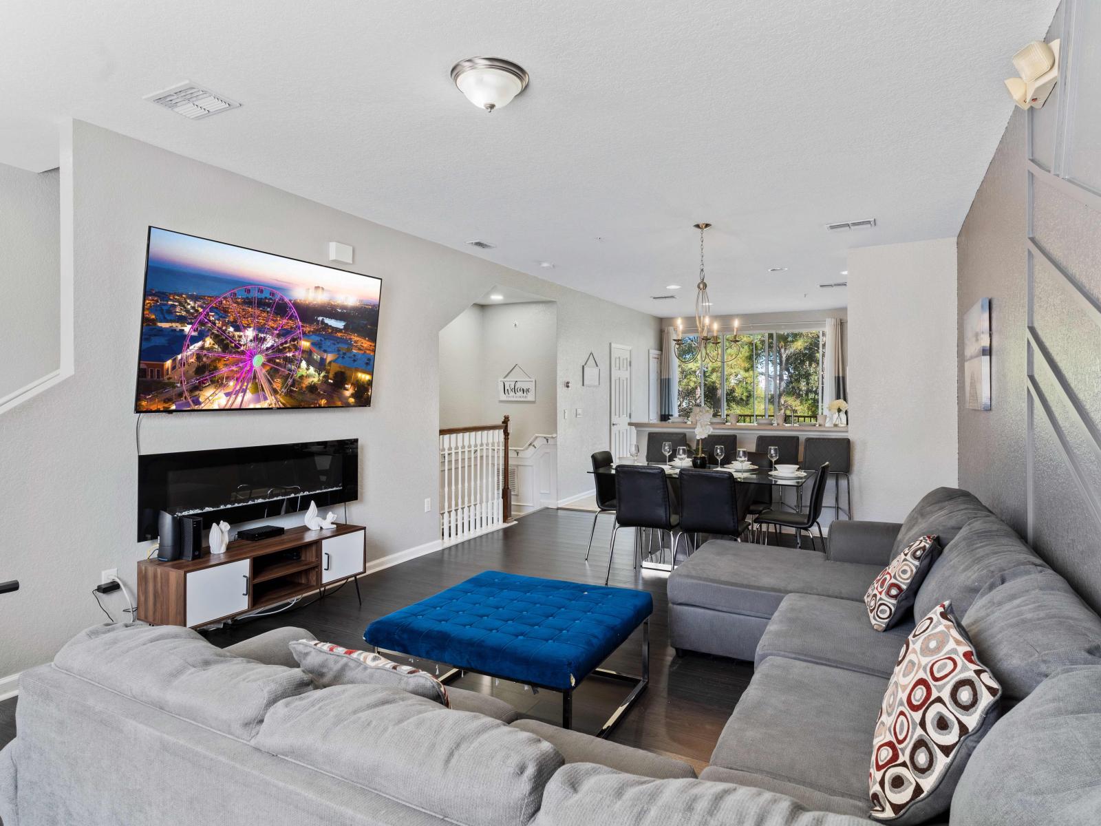 Living room with foosball table, electric fireplace and Smart TV