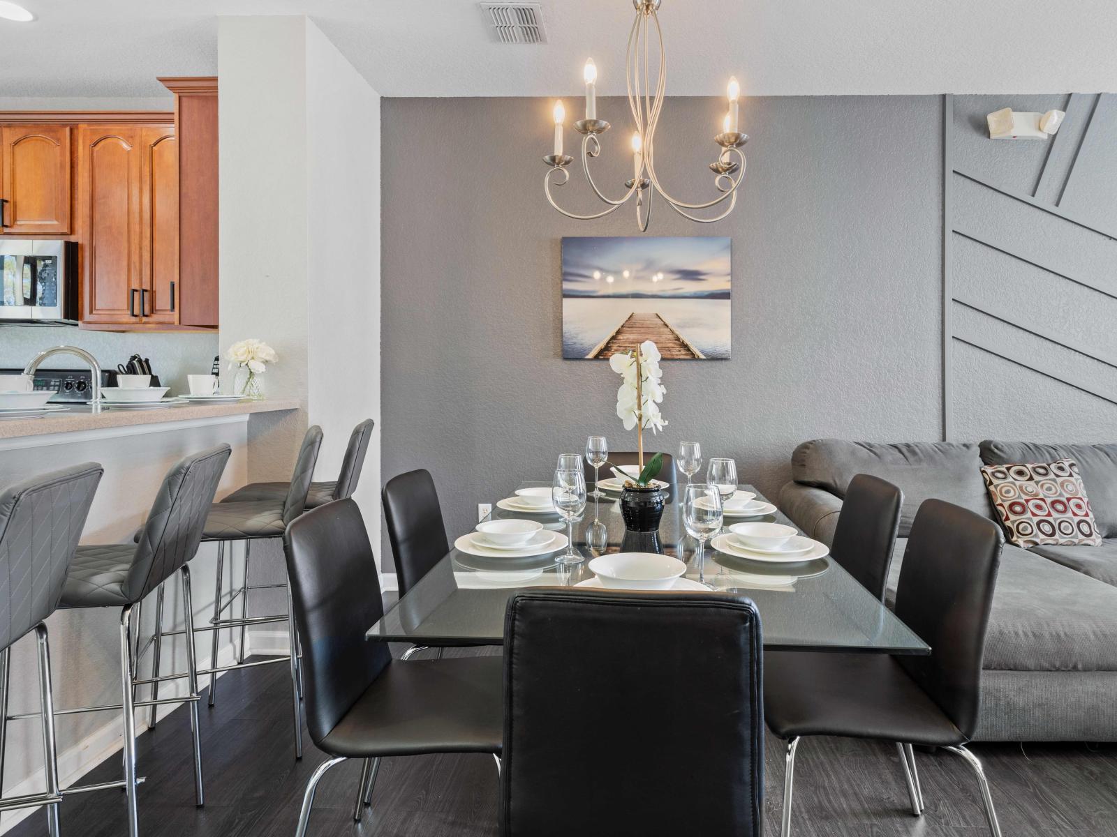 Sleek and Social: Experience the allure of our living area, harmoniously combining a contemporary kitchen and a social dining space for an urban retreat