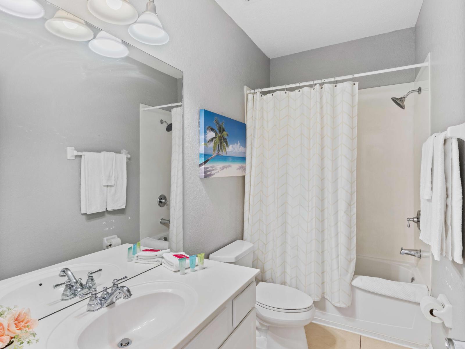 Convenience and Comfort Combined: Attached Bathroom 2 Features a Relaxing Tub/Shower Combination.