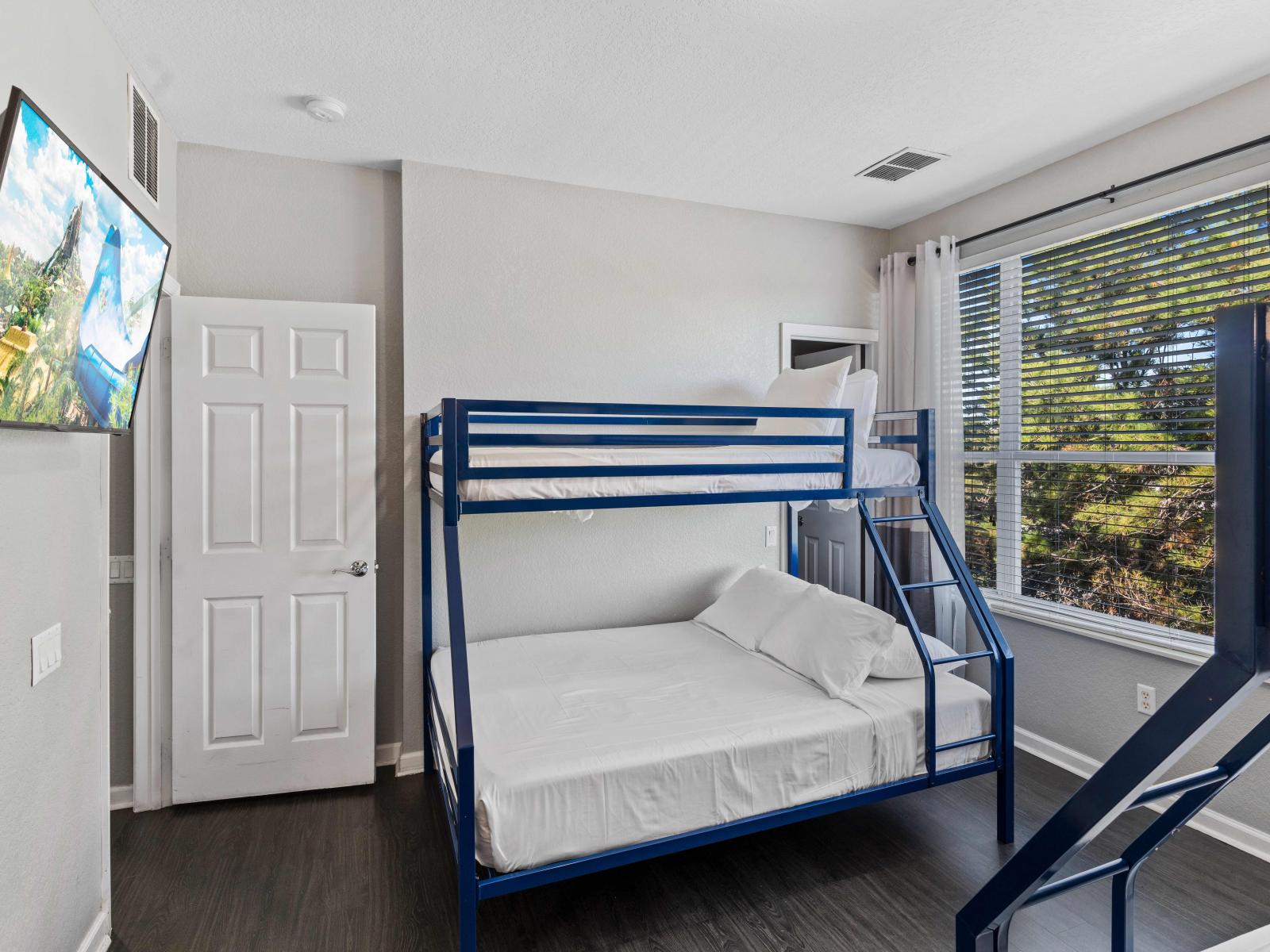 Fun-Filled Slumber Parties Await: Bedroom 3 Features Two Single over Double Bunk Beds for Ultimate Sleepovers.