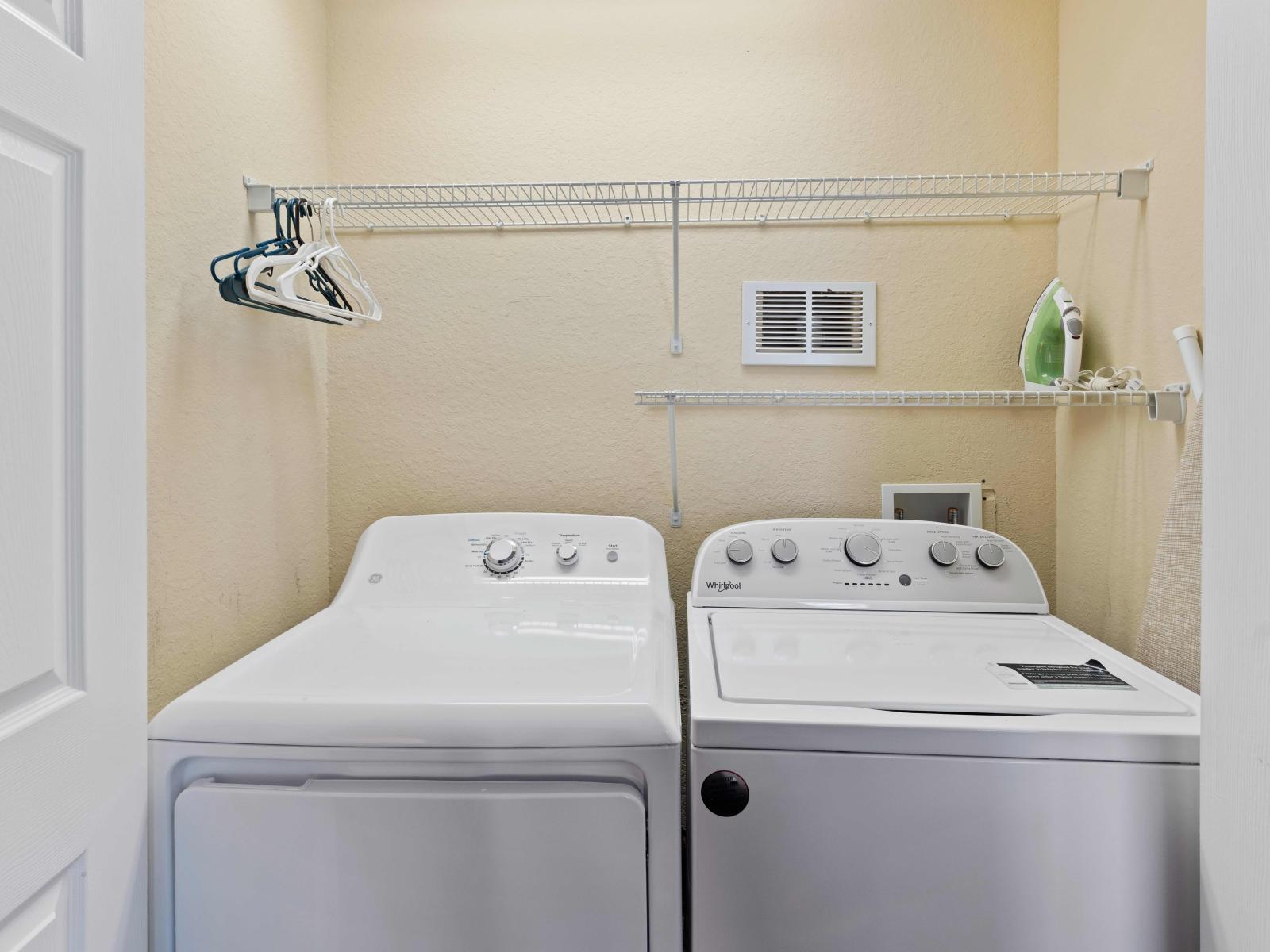 Laundry room with full washer and dryer