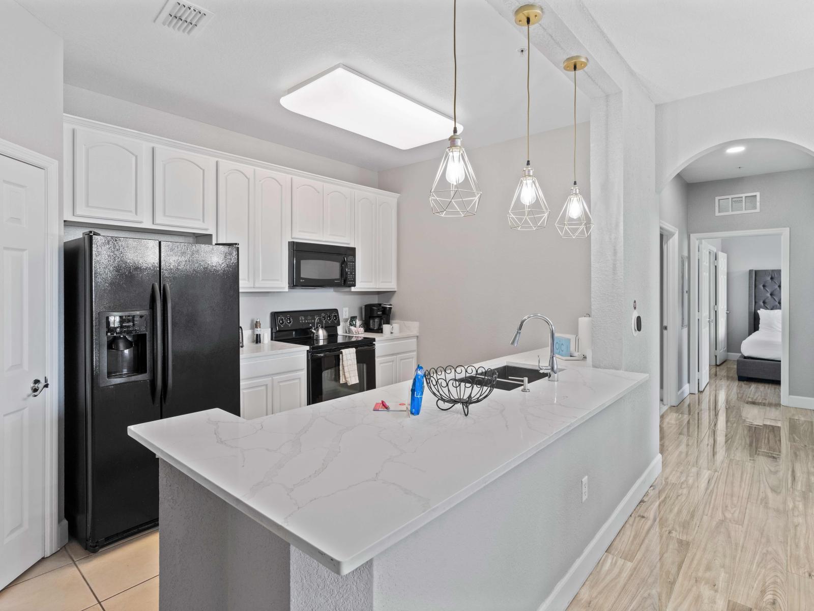 Spectacular Kitchen of the condo in Orlando - Amazing stainless steel appliances available  - Modern design with elegant lighting - Smart use of space with sufficient storage solutions