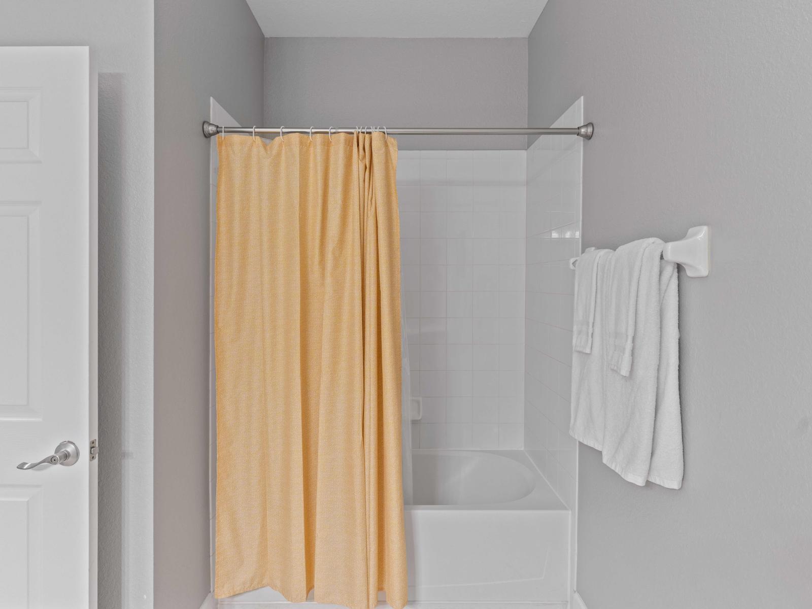 This bathroom features a convenient tub/shower combination, offering flexibility and comfort for your stay.